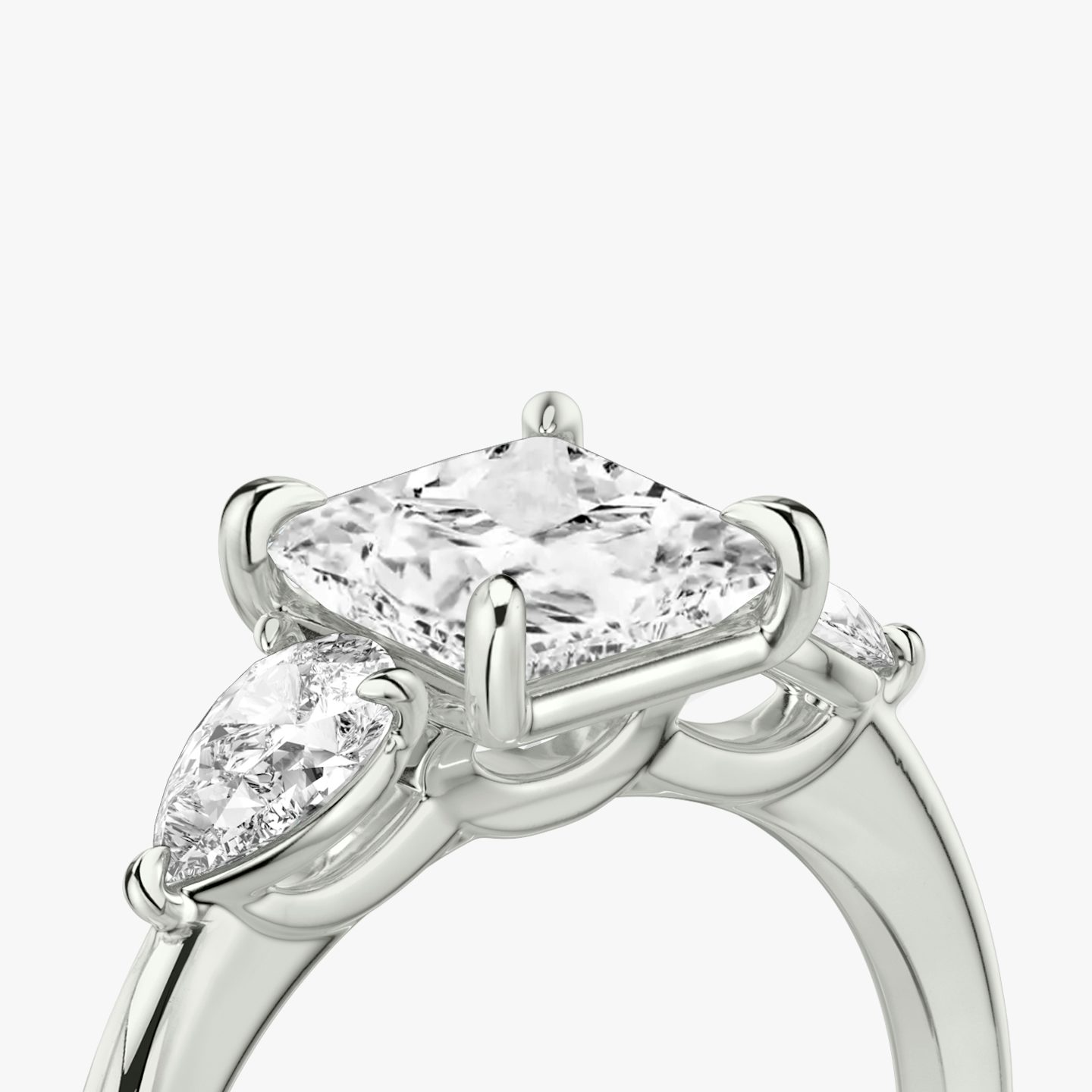 The Three Stone | Princess | Platinum | bandAccent: Plain | sideStoneCarat: 0.25ct | sideStoneShape: Pear | diamondOrientation: vertical | caratWeight: other