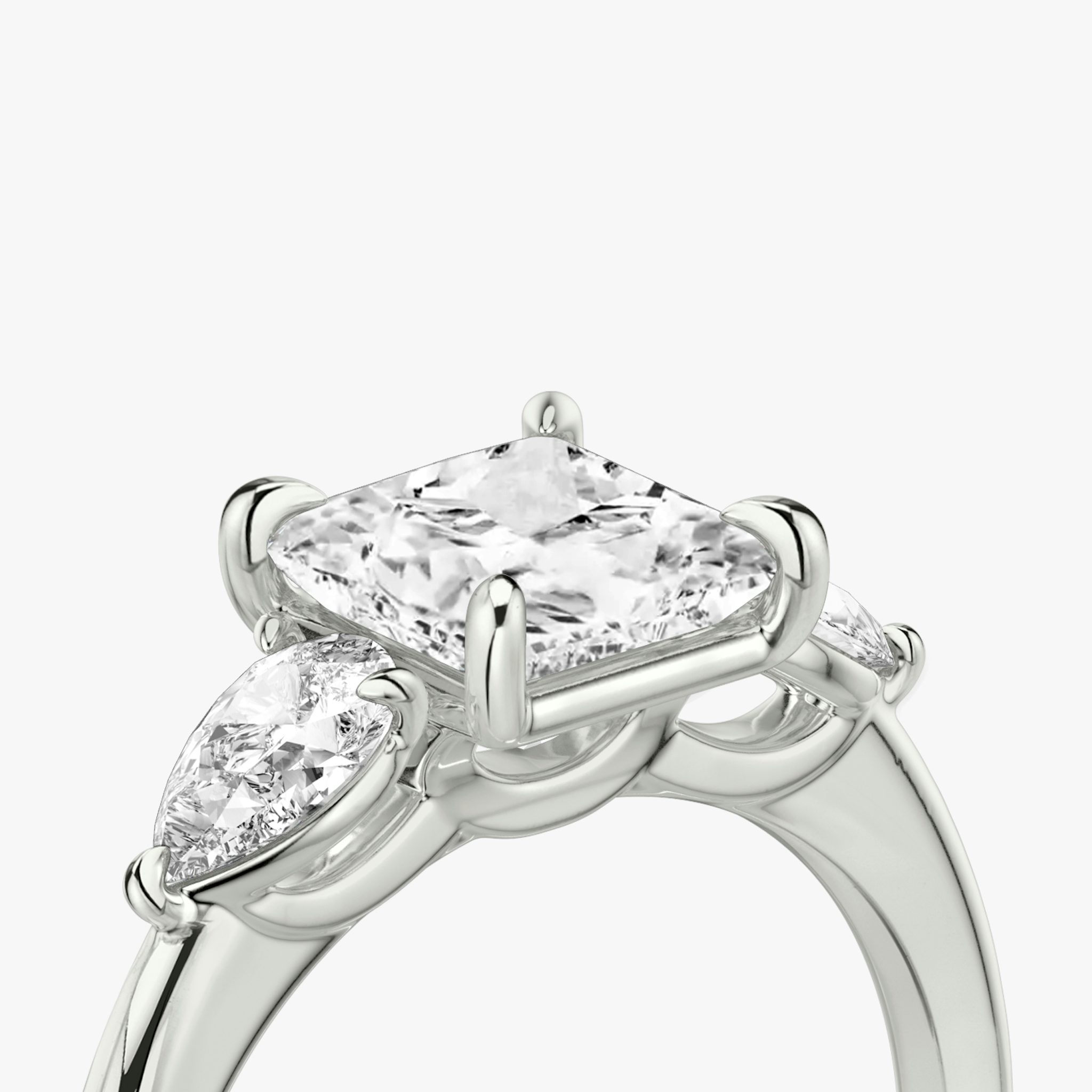 The Three Stone | Princess | 18k | White Gold | bandAccent: Plain | sideStoneCarat: 0.25ct | sideStoneShape: Pear | diamondOrientation: vertical | caratWeight: other