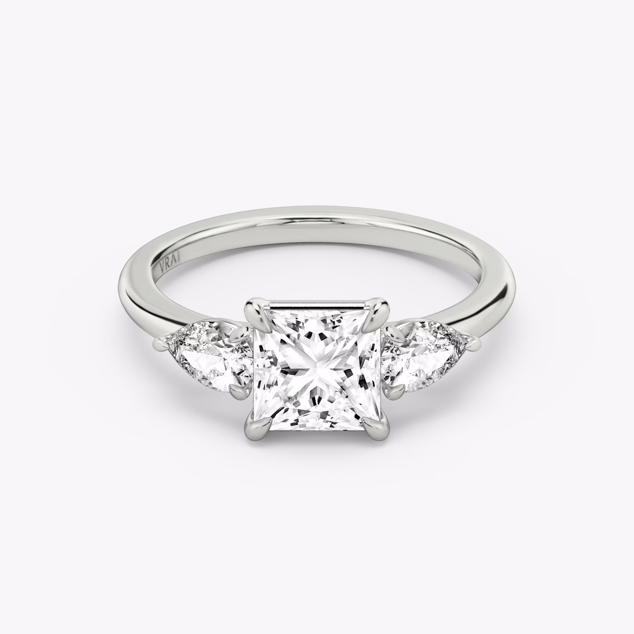The Three Stone | Princess | 18k | White Gold | bandAccent: Plain | sideStoneCarat: 0.25ct | sideStoneShape: Pear | diamondOrientation: vertical | caratWeight: other