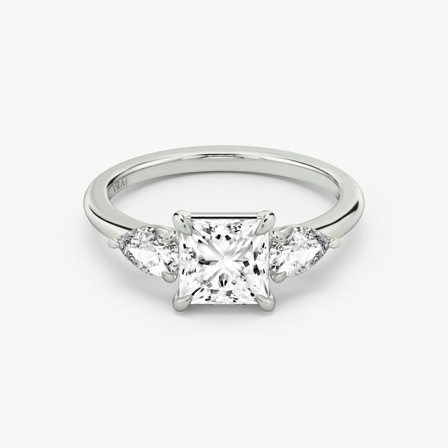 The Three Stone | Princess | Platinum | bandAccent: Plain | sideStoneCarat: 0.25ct | sideStoneShape: Pear | diamondOrientation: vertical | caratWeight: other
