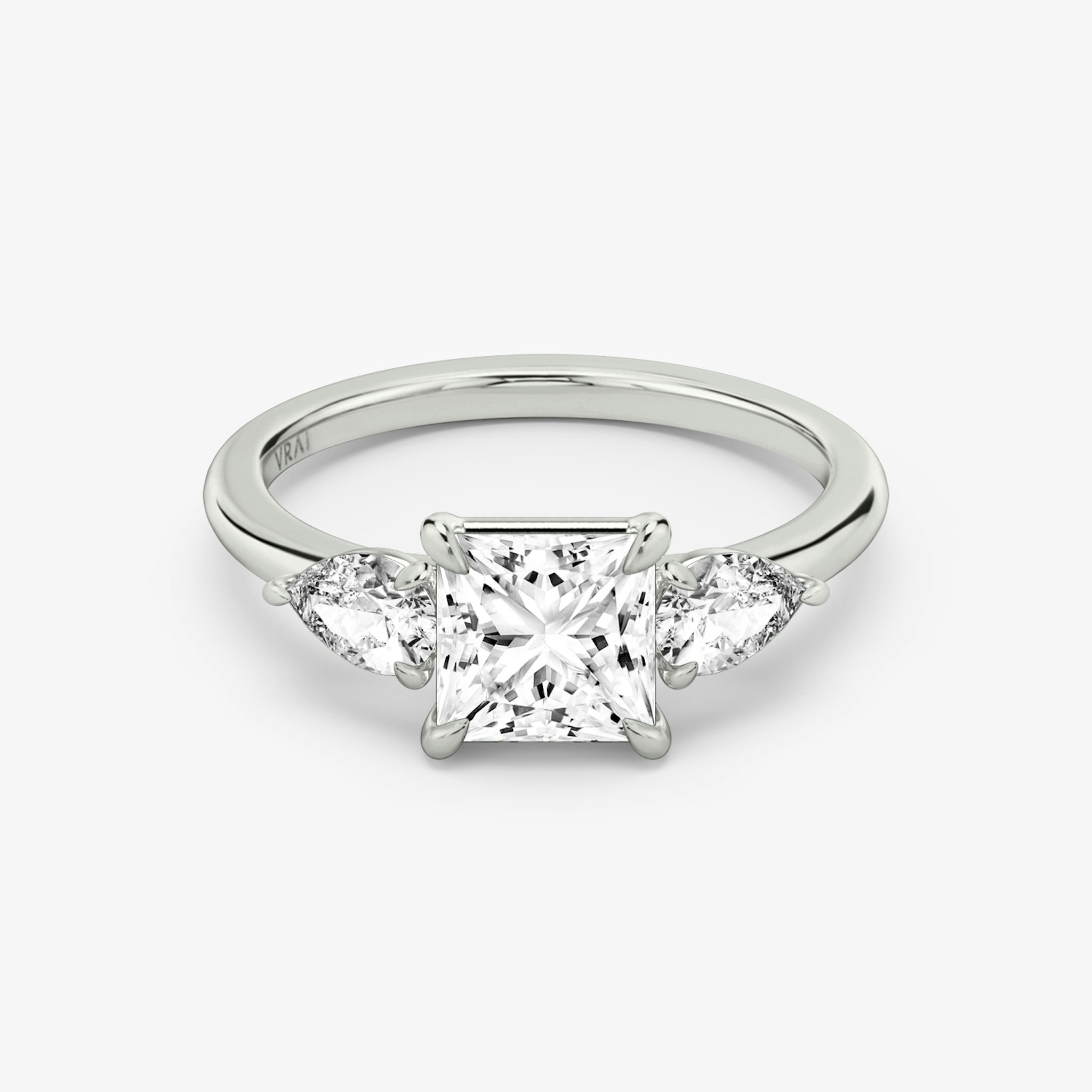 The Three Stone | Princess | 18k | White Gold | bandAccent: Plain | sideStoneCarat: 0.25ct | sideStoneShape: Pear | diamondOrientation: vertical | caratWeight: other