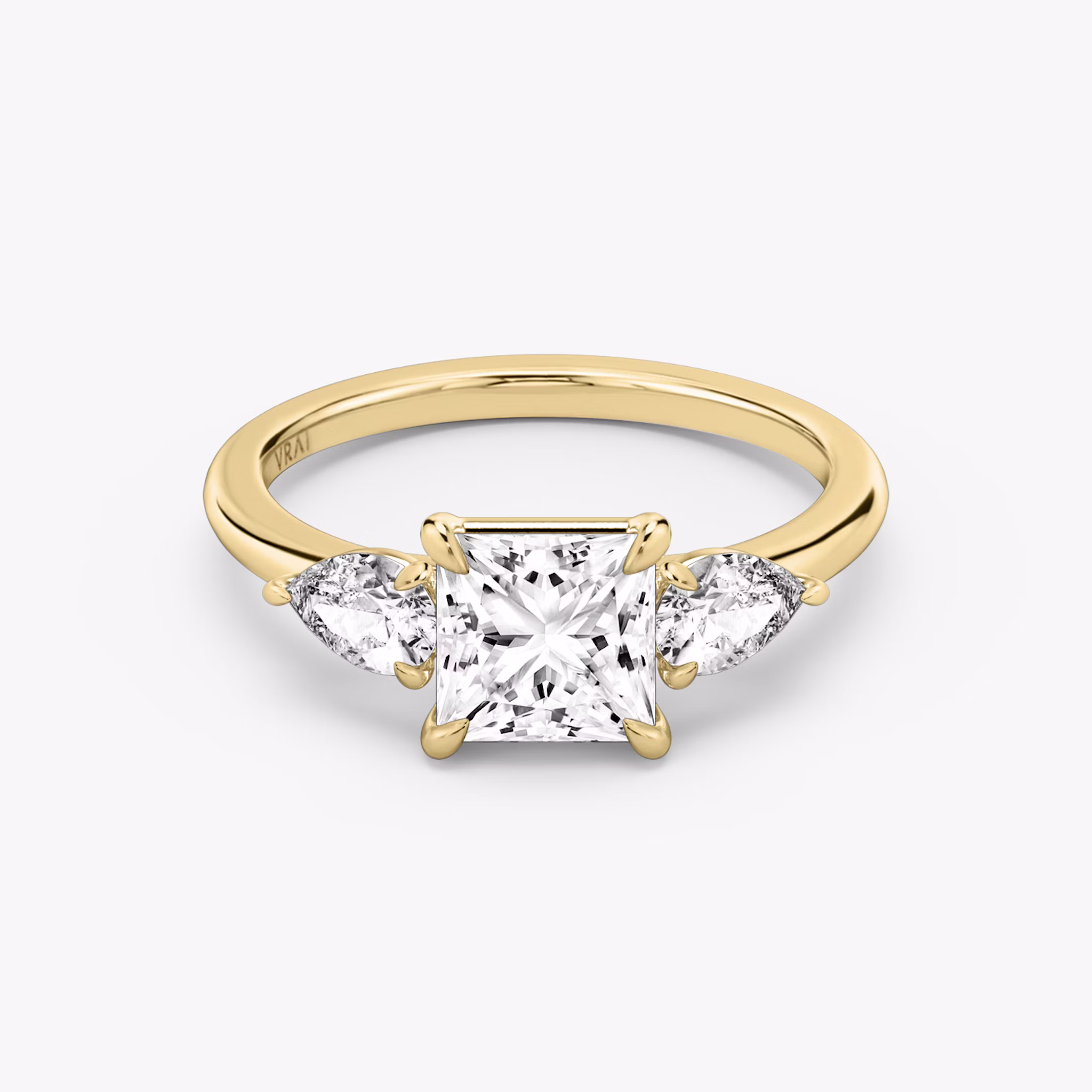 The Three Stone | Princess | 18k | Yellow Gold | bandAccent: Plain | sideStoneCarat: 0.25ct | sideStoneShape: Pear | diamondOrientation: vertical | caratWeight: other