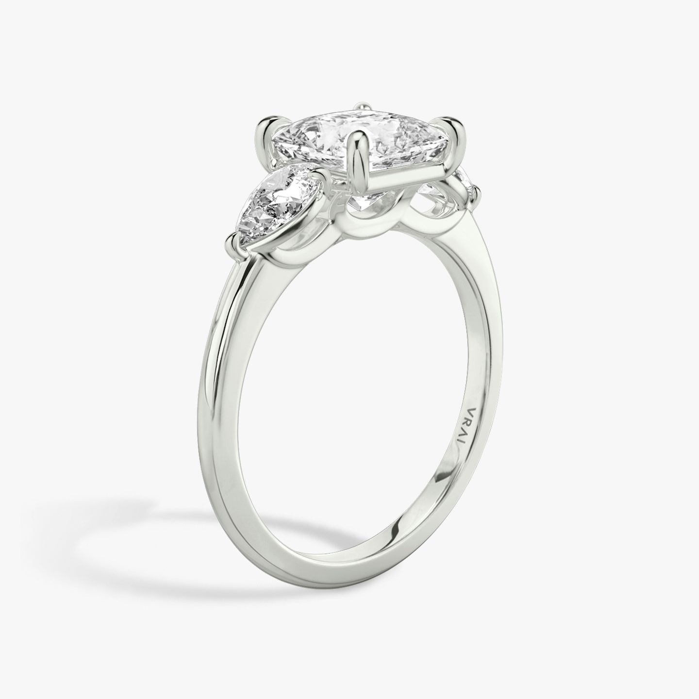 The Three Stone | Princess | Platinum | bandAccent: Plain | sideStoneCarat: 0.25ct | sideStoneShape: Pear | diamondOrientation: vertical | caratWeight: other