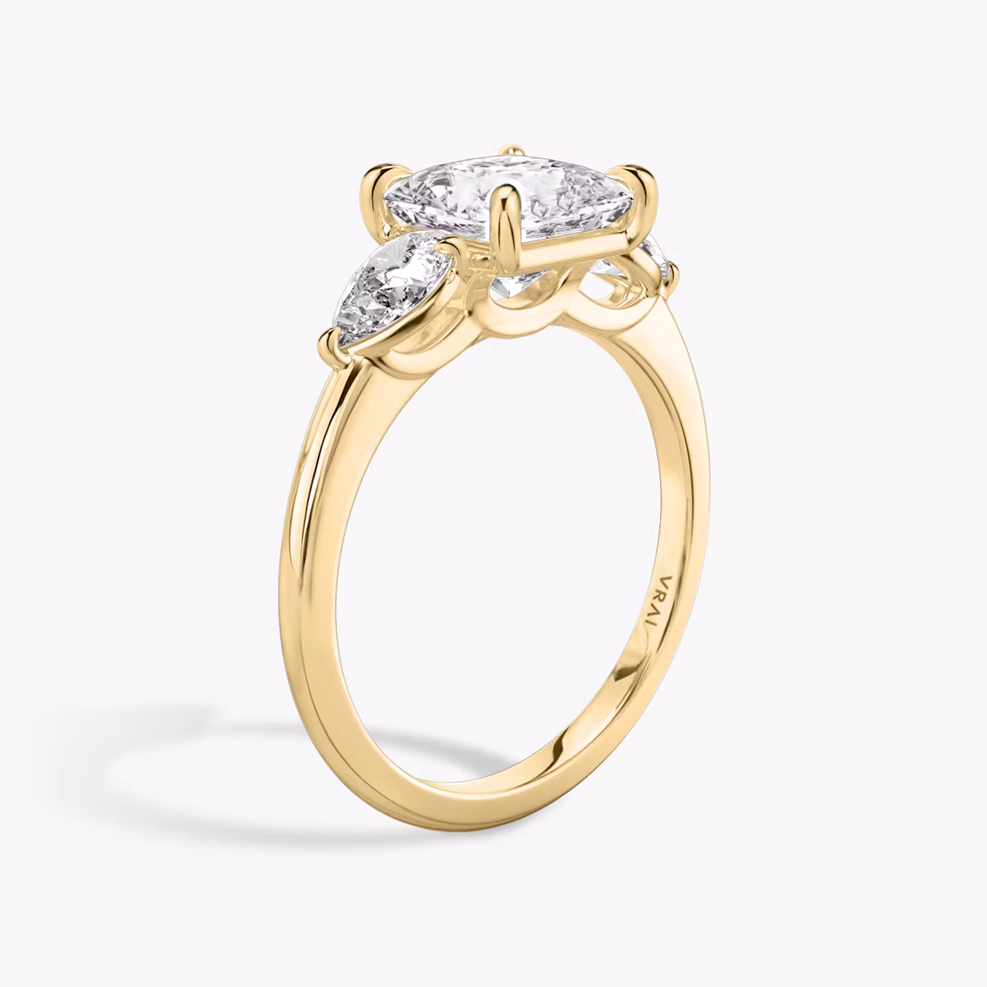 The Three Stone | Princess | 18k | Yellow Gold | bandAccent: Plain | sideStoneCarat: 0.25ct | sideStoneShape: Pear | diamondOrientation: vertical | caratWeight: other