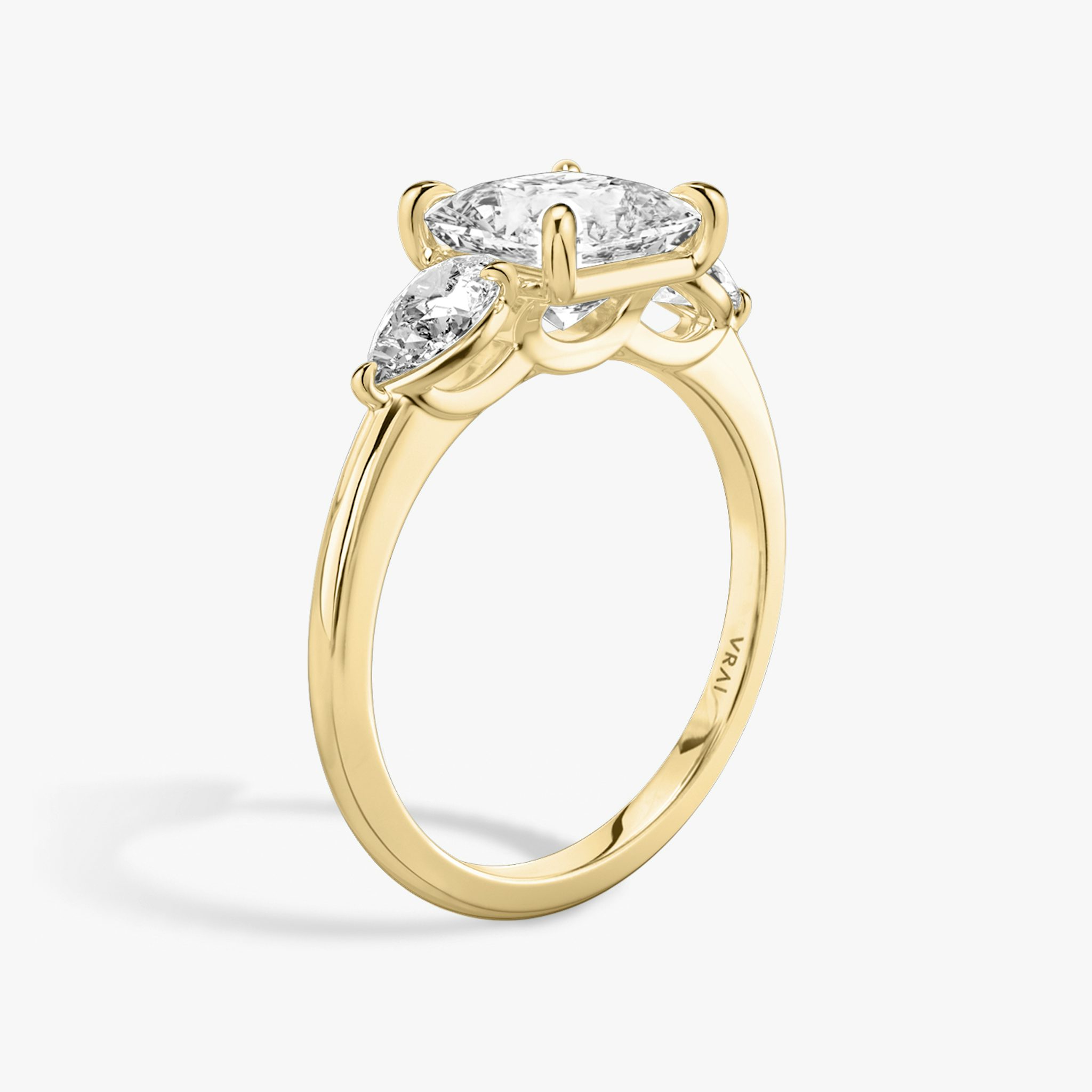 The Three Stone | Princess | 18k | Yellow Gold | bandAccent: Plain | sideStoneCarat: 0.25ct | sideStoneShape: Pear | diamondOrientation: vertical | caratWeight: other