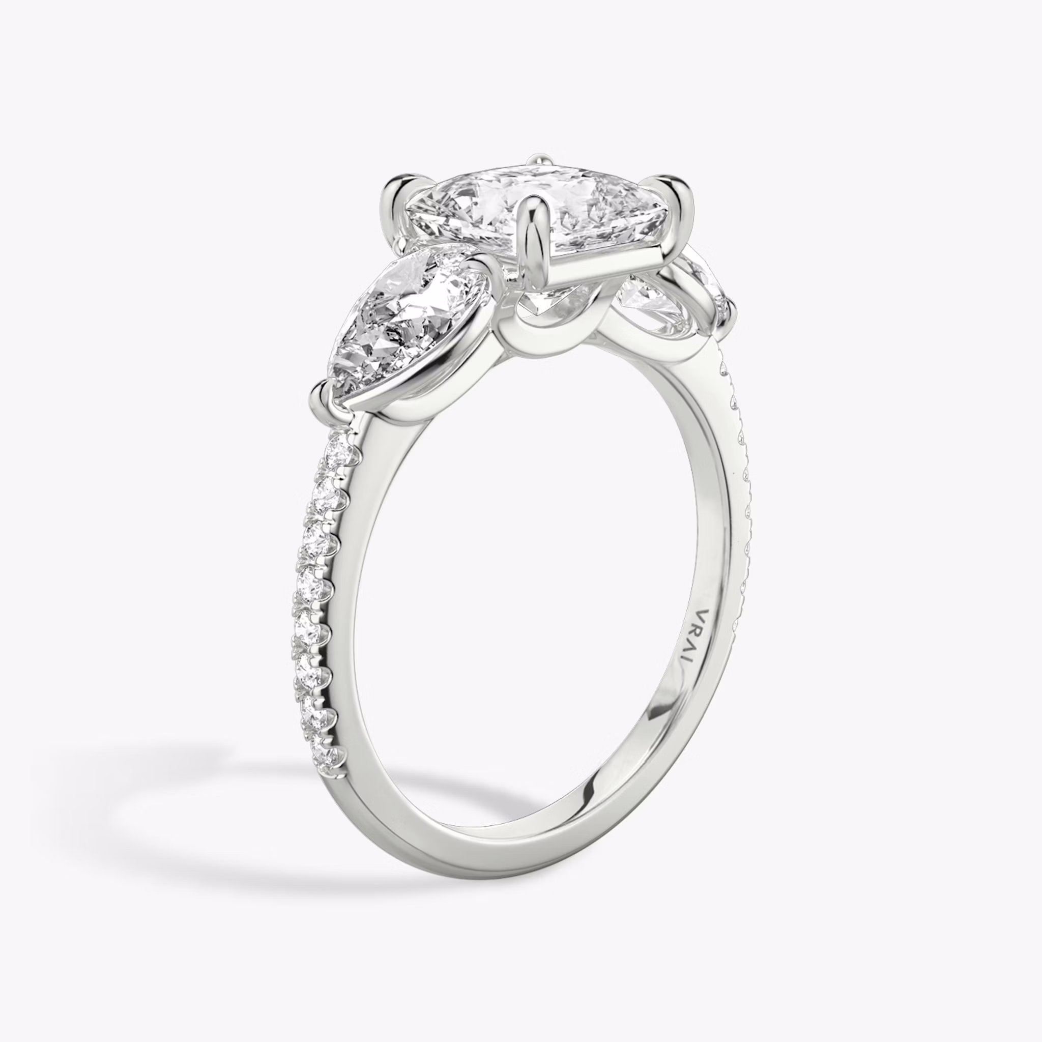 The Three Stone | Princess | 18k | White Gold | bandAccent: Pavé | sideStoneCarat: 0.50ct | sideStoneShape: Pear | diamondOrientation: vertical | caratWeight: other