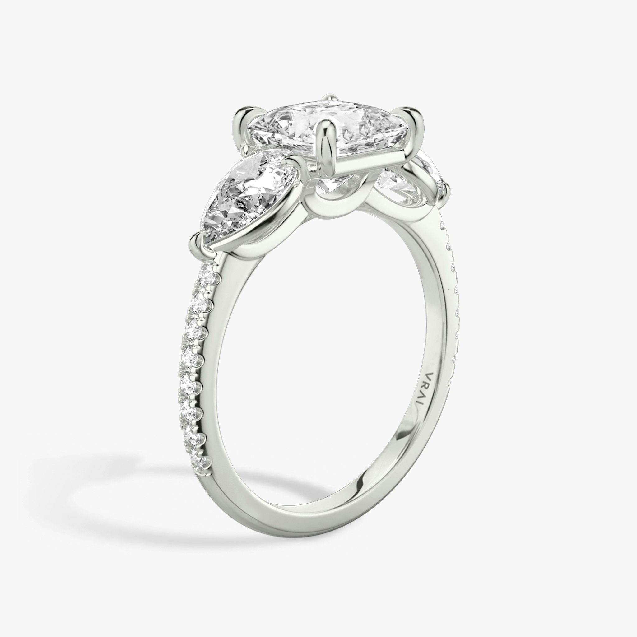 The Three Stone | Princess | 18k | White Gold | bandAccent: Pavé | sideStoneCarat: 0.50ct | sideStoneShape: Pear | diamondOrientation: vertical | caratWeight: other