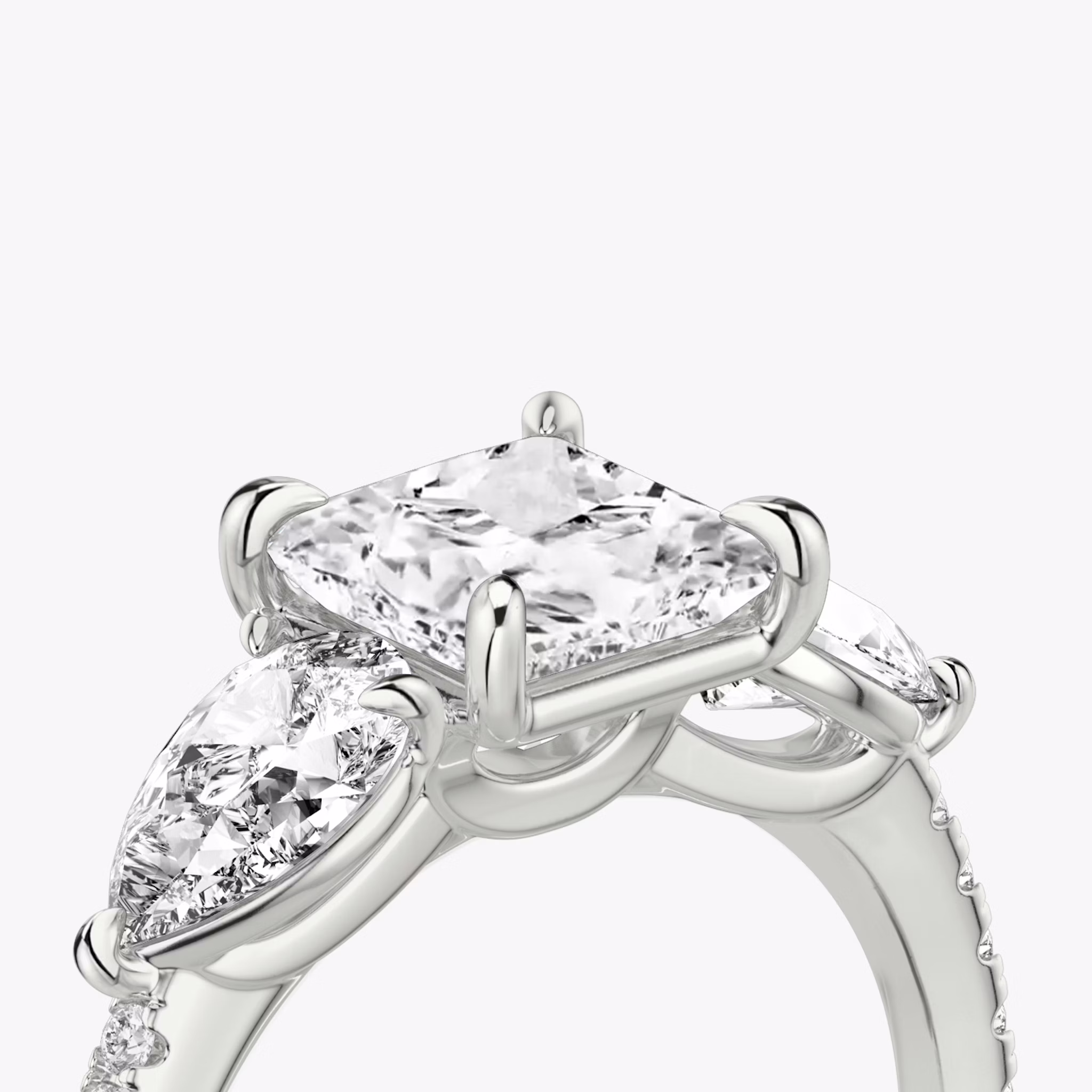 The Three Stone | Princess | 18k | White Gold | bandAccent: Pavé | sideStoneCarat: 0.50ct | sideStoneShape: Pear | diamondOrientation: vertical | caratWeight: other