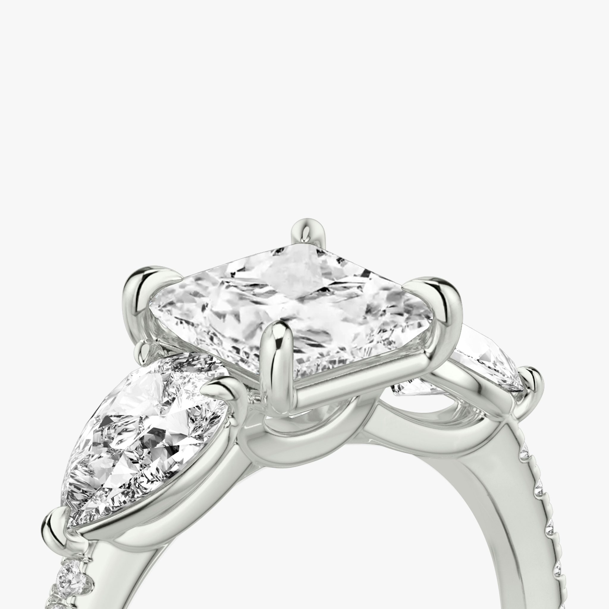 The Three Stone | Princess | 18k | White Gold | bandAccent: Pavé | sideStoneCarat: 0.50ct | sideStoneShape: Pear | diamondOrientation: vertical | caratWeight: other
