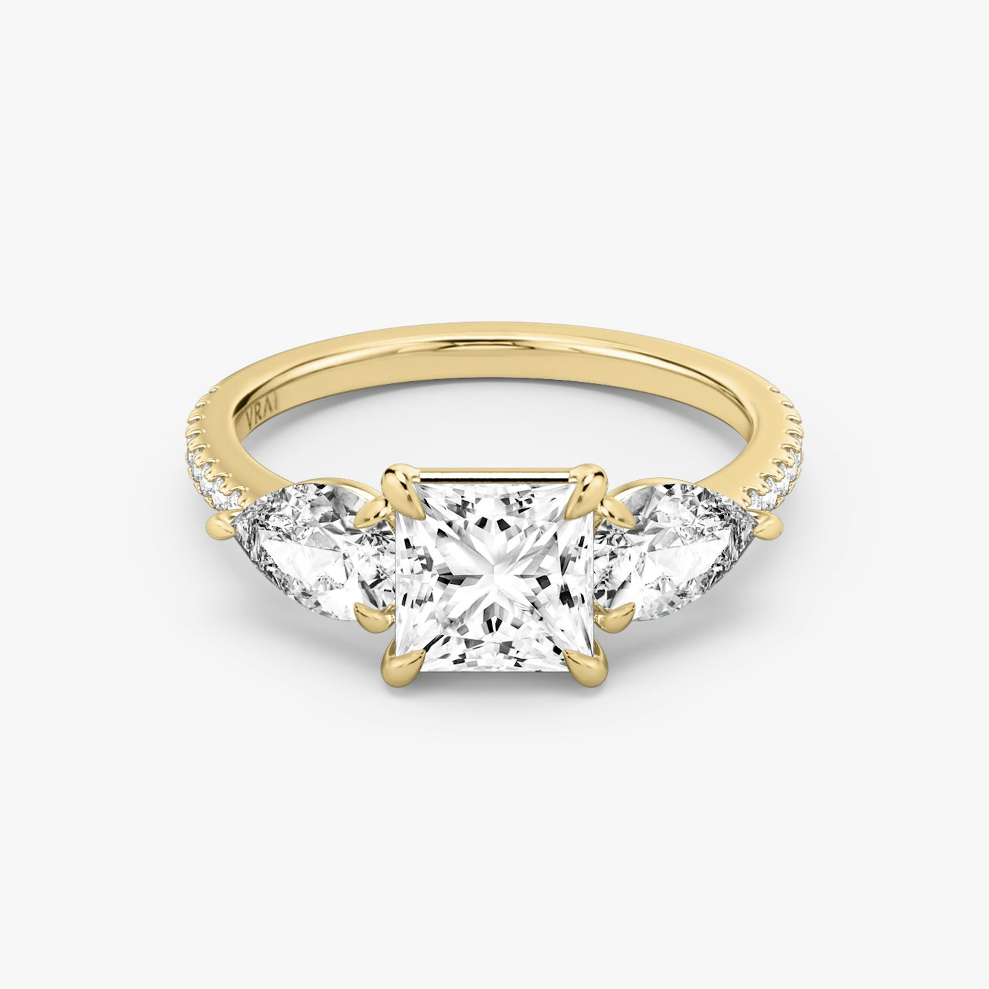 The Three Stone | Princess | 18k | Yellow Gold | bandAccent: Pavé | sideStoneCarat: 0.50ct | sideStoneShape: Pear | diamondOrientation: vertical | caratWeight: other