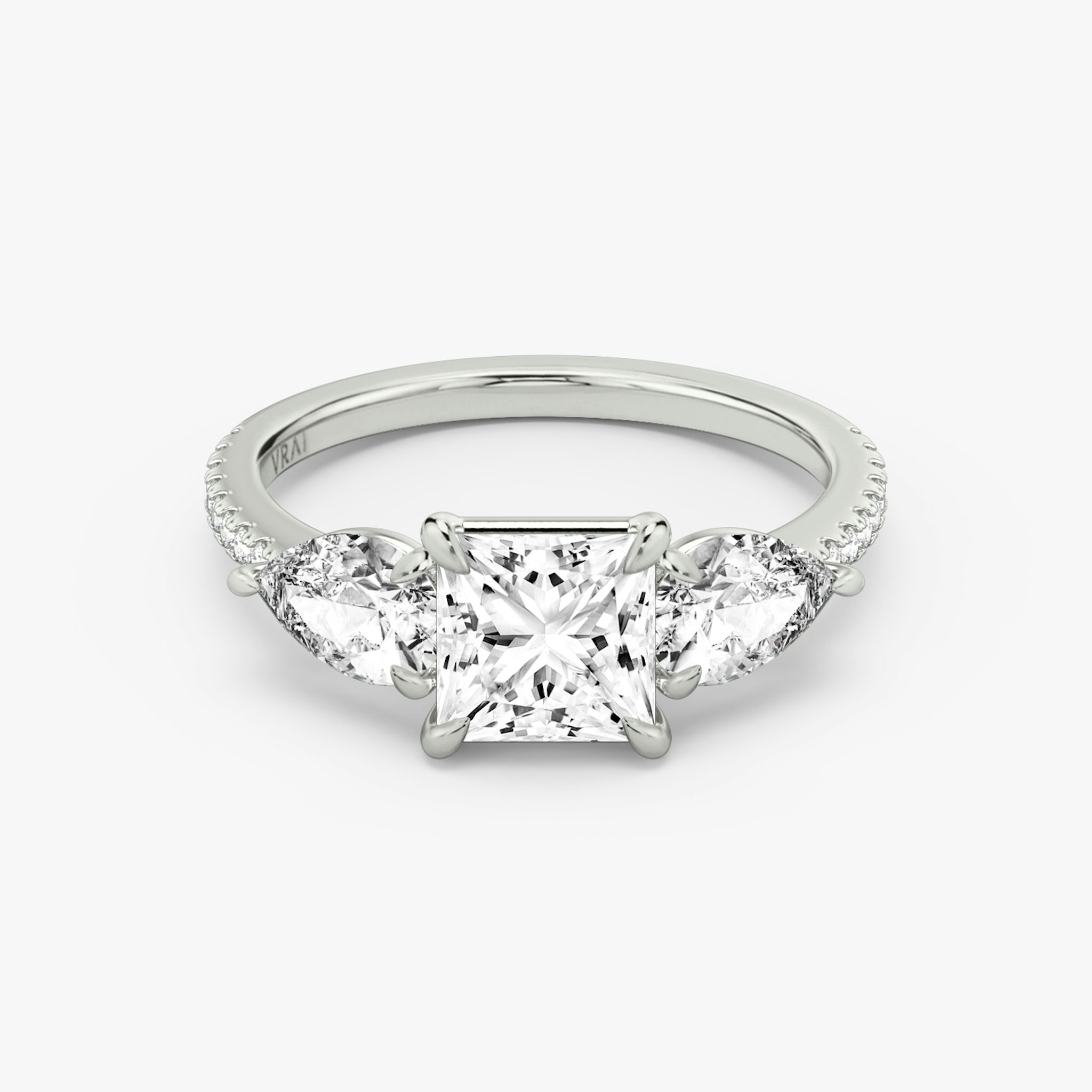 The Three Stone | Princess | 18k | White Gold | bandAccent: Pavé | sideStoneCarat: 0.50ct | sideStoneShape: Pear | diamondOrientation: vertical | caratWeight: other