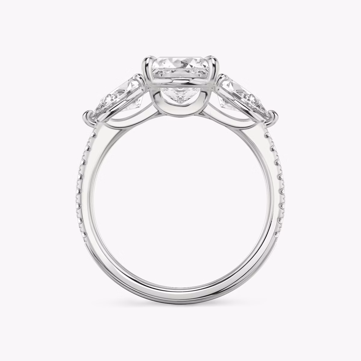 The Three Stone | Princess | Platinum | bandAccent: Pavé | sideStoneCarat: 0.50ct | sideStoneShape: Pear | diamondOrientation: vertical | caratWeight: other
