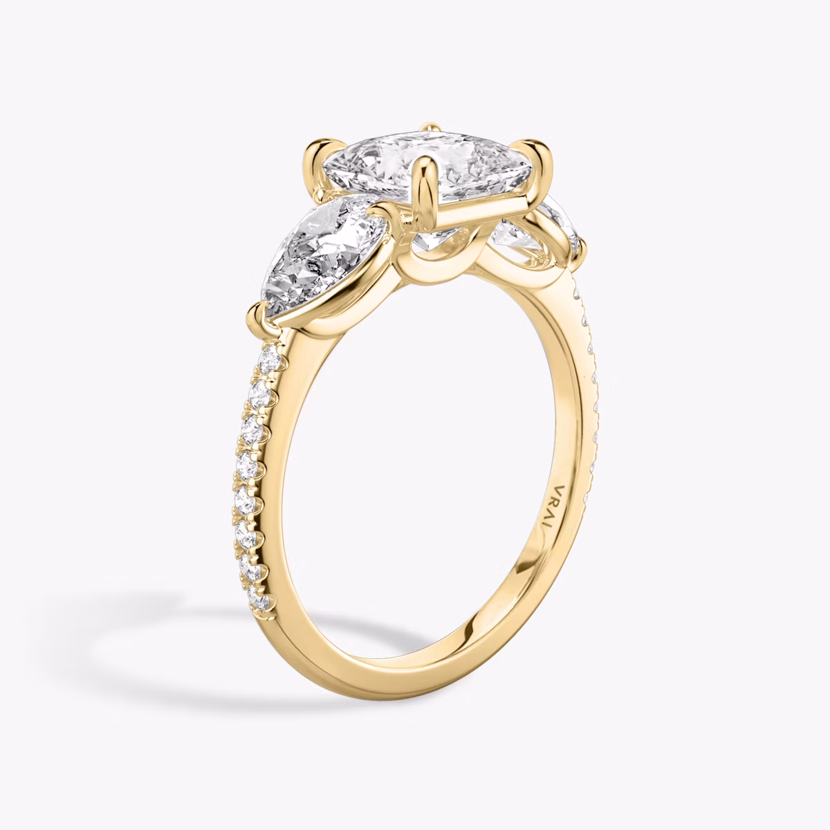 The Three Stone | Princess | 18k | Yellow Gold | bandAccent: Pavé | sideStoneCarat: 0.50ct | sideStoneShape: Pear | diamondOrientation: vertical | caratWeight: other
