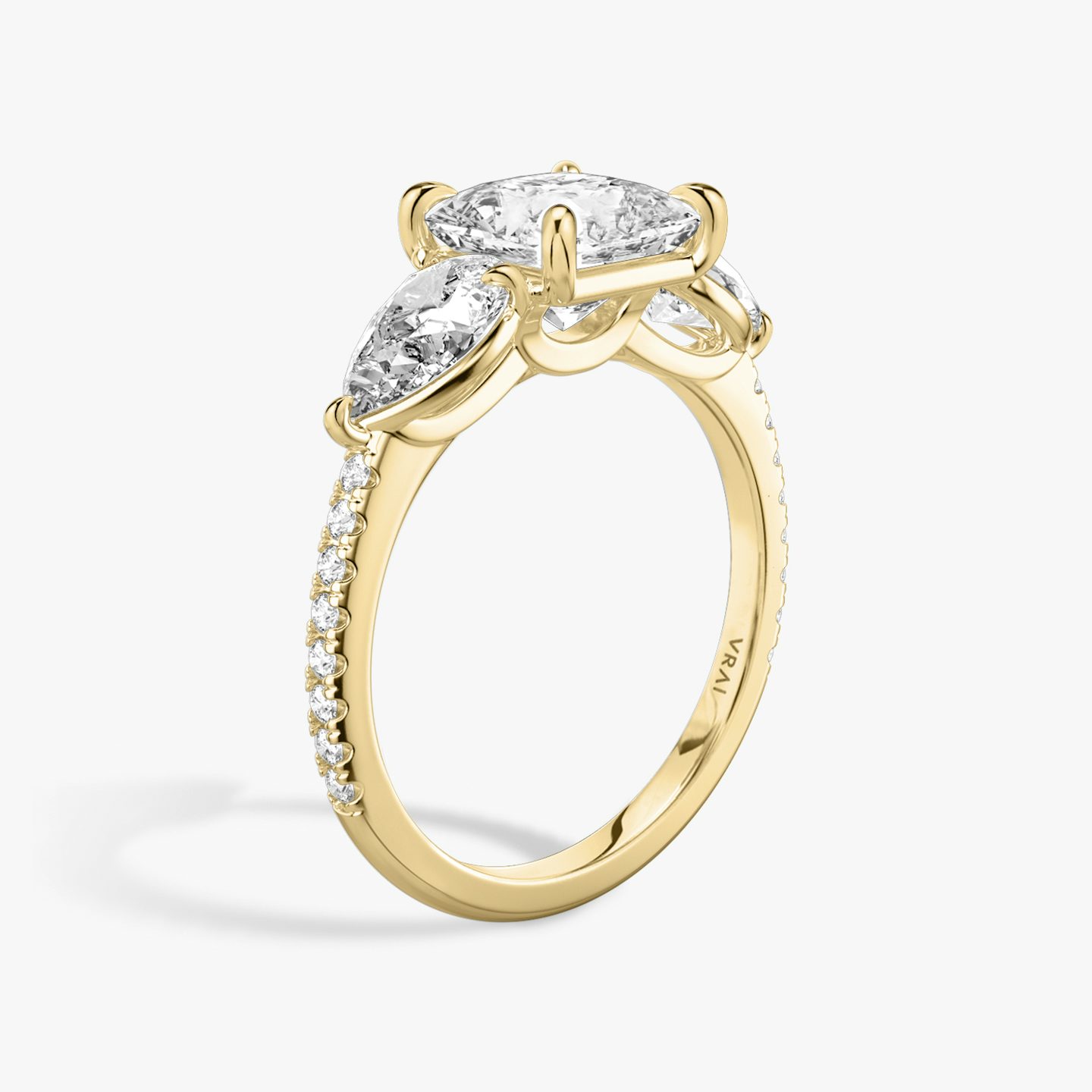 The Three Stone | Princess | 18k | Yellow Gold | bandAccent: Pavé | sideStoneCarat: 0.50ct | sideStoneShape: Pear | diamondOrientation: vertical | caratWeight: other