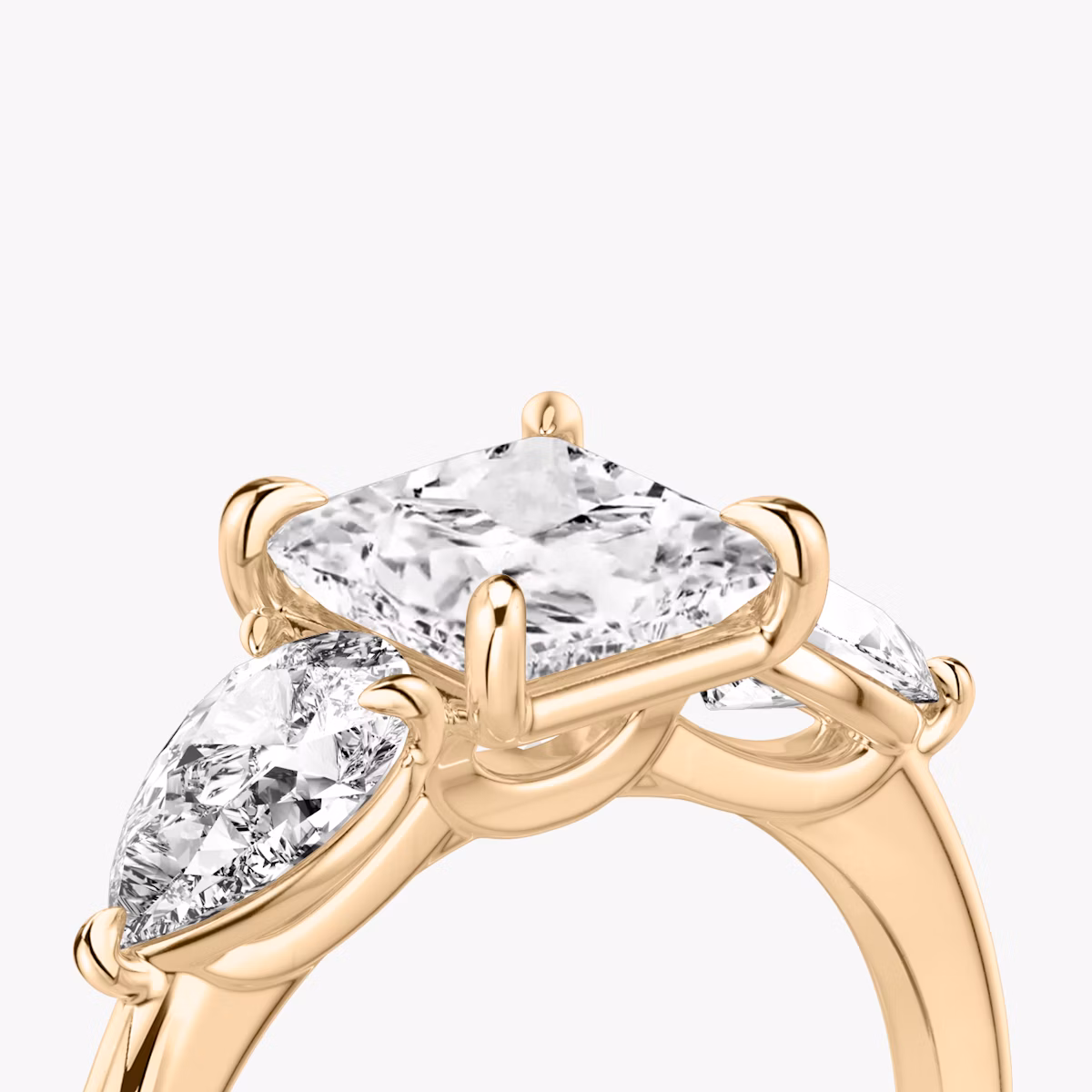 The Three Stone | Princess | 14k | Rose Gold | bandAccent: Plain | sideStoneCarat: 0.50ct | sideStoneShape: Pear | diamondOrientation: vertical | caratWeight: other