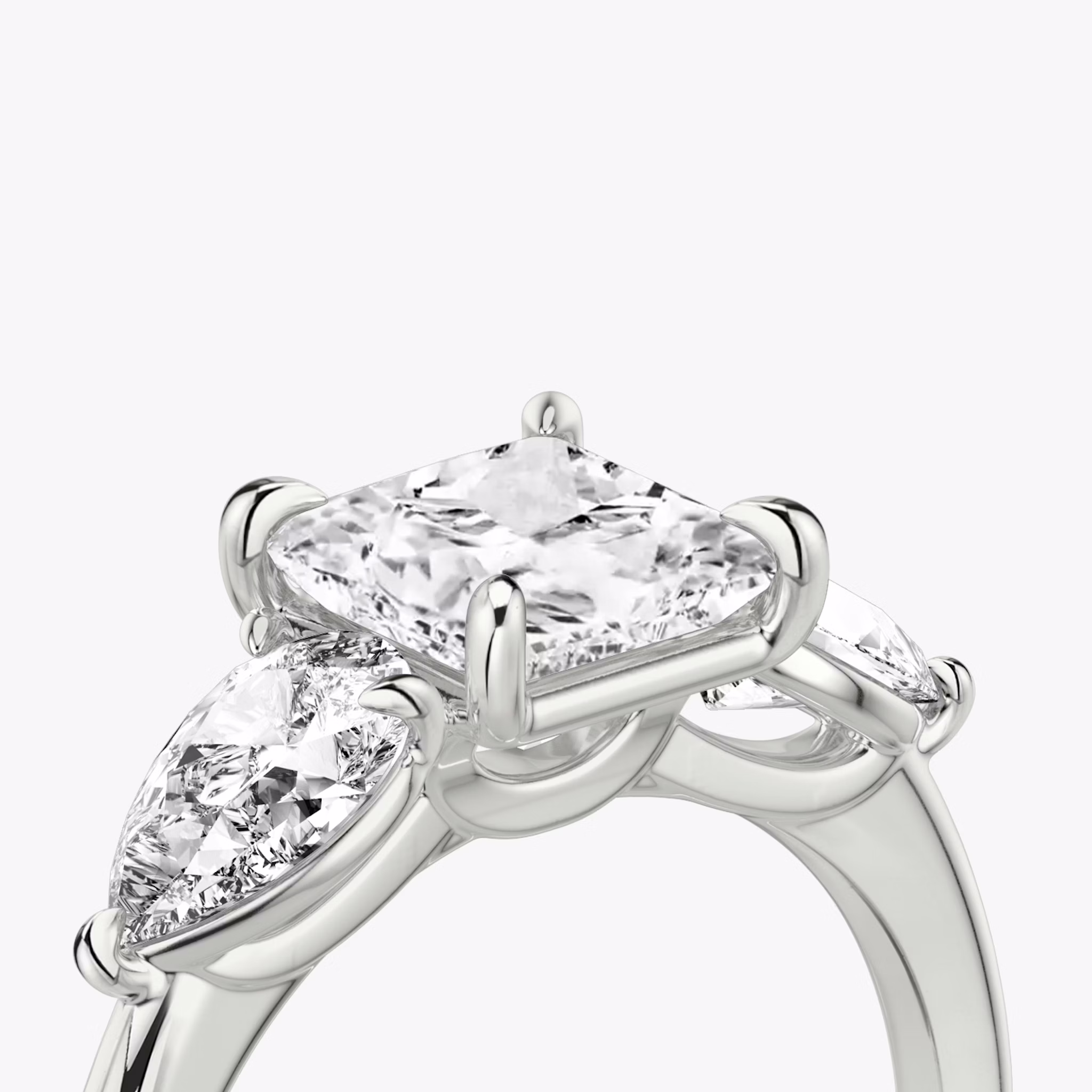 The Three Stone | Princess | 18k | White Gold | bandAccent: Plain | sideStoneCarat: 0.50ct | sideStoneShape: Pear | diamondOrientation: vertical | caratWeight: other