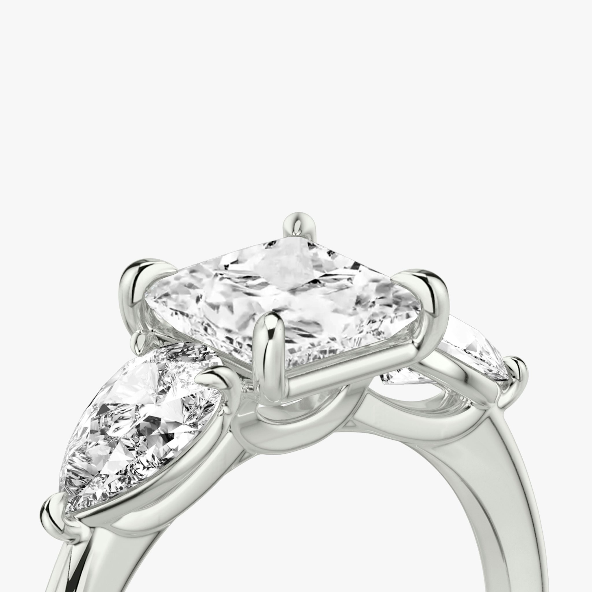 The Three Stone | Princess | 18k | White Gold | bandAccent: Plain | sideStoneCarat: 0.50ct | sideStoneShape: Pear | diamondOrientation: vertical | caratWeight: other
