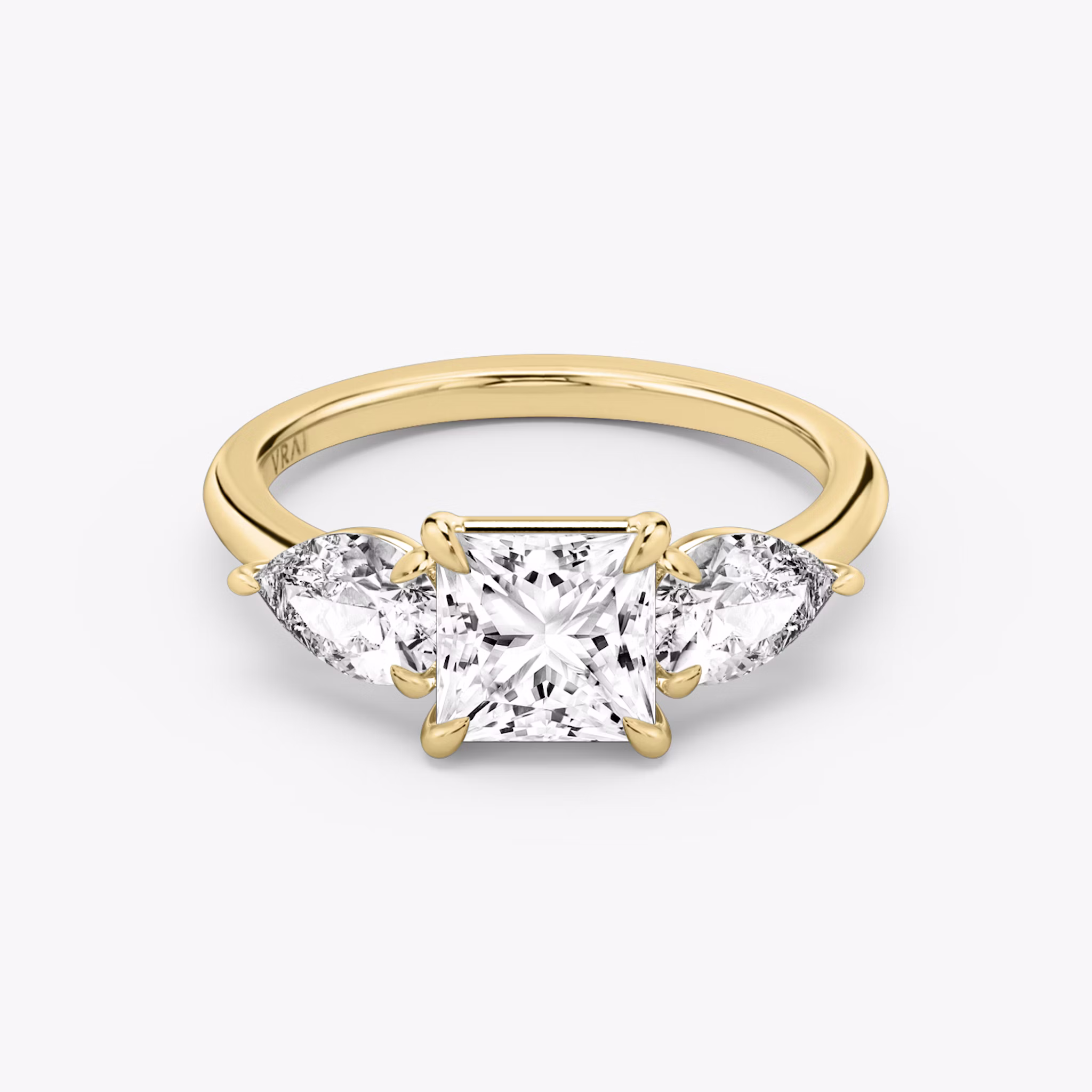 The Three Stone | Princess | 18k | Yellow Gold | bandAccent: Plain | sideStoneCarat: 0.50ct | sideStoneShape: Pear | diamondOrientation: vertical | caratWeight: other