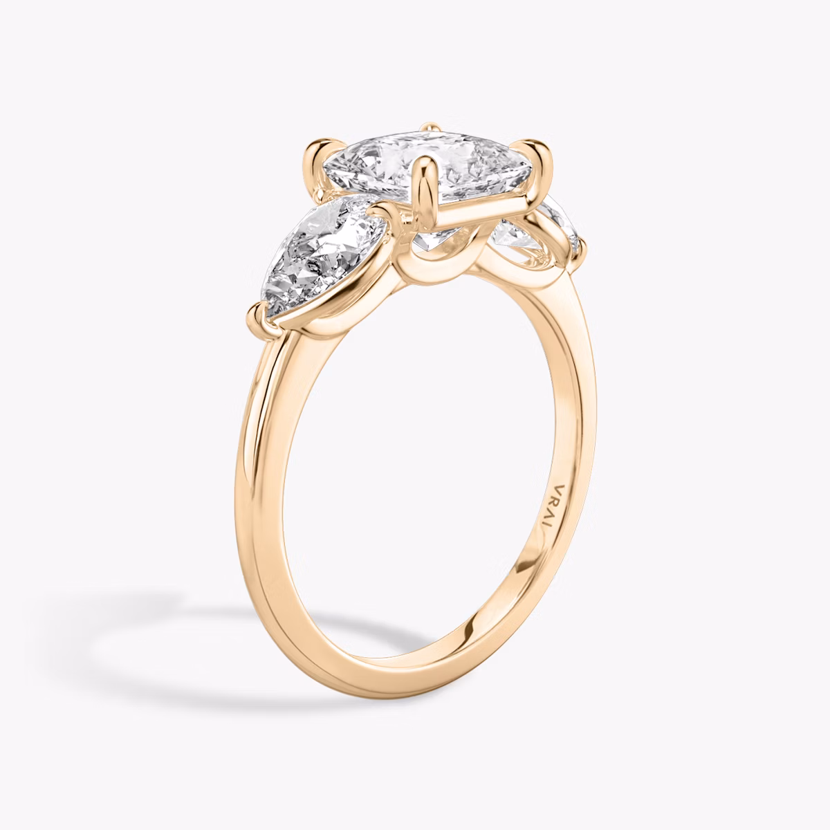 The Three Stone | Princess | 14k | Rose Gold | bandAccent: Plain | sideStoneCarat: 0.50ct | sideStoneShape: Pear | diamondOrientation: vertical | caratWeight: other