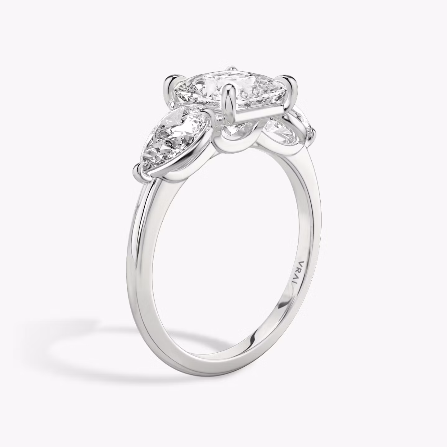 Three Stone | princess | platinum | bandAccent: plain | sideStoneCarat: 0.50ct | sideStoneShape: pear | diamondOrientation: vertical | caratWeight: other