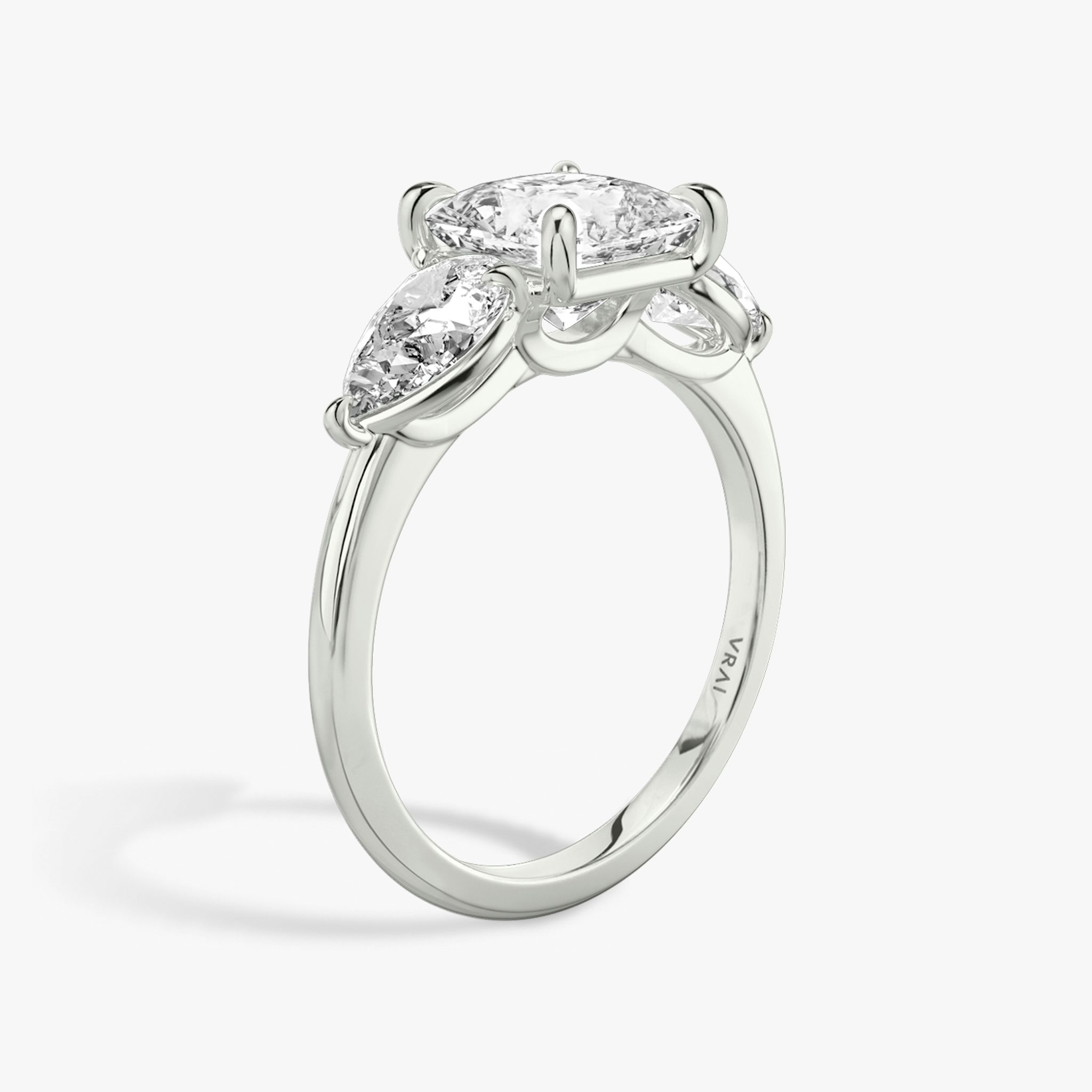 The Three Stone | Princess | 18k | White Gold | bandAccent: Plain | sideStoneCarat: 0.50ct | sideStoneShape: Pear | diamondOrientation: vertical | caratWeight: other
