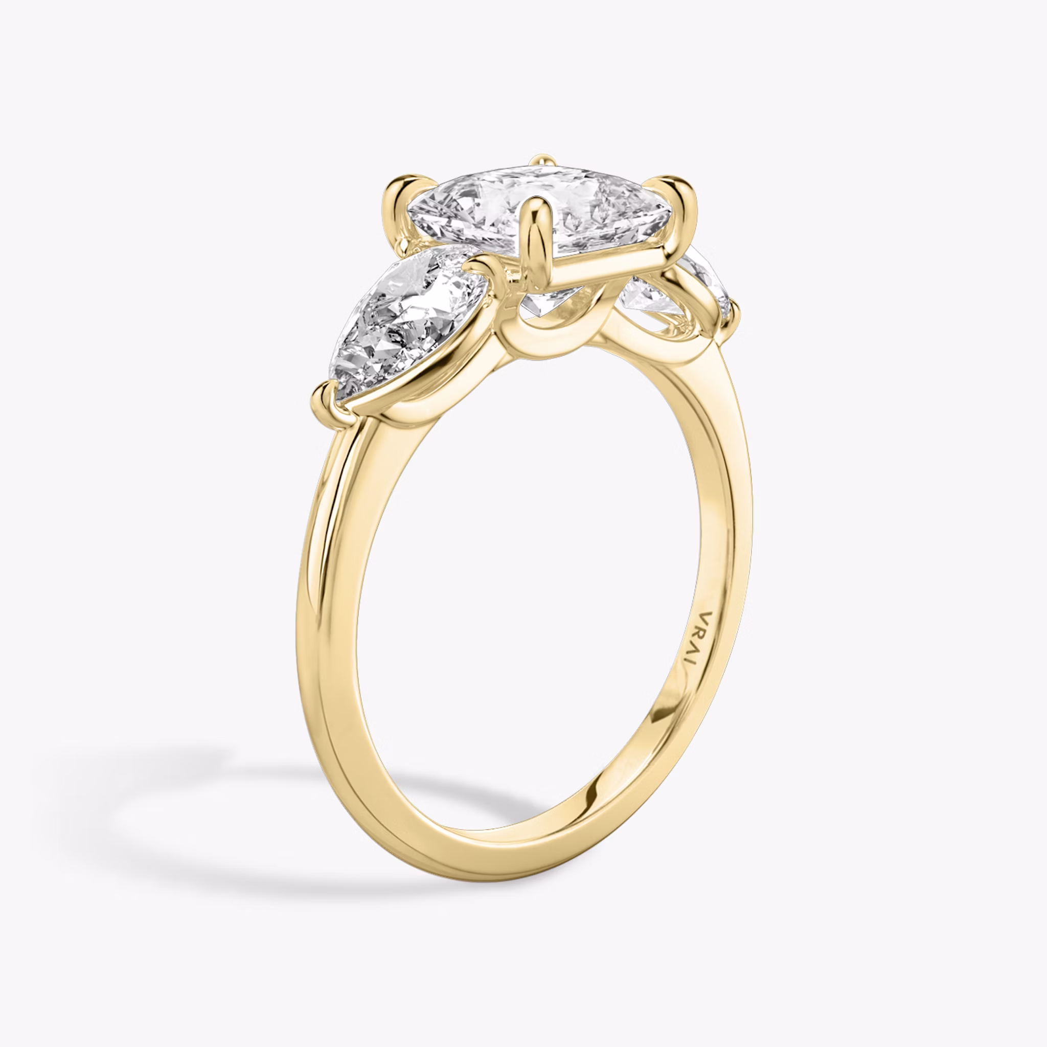 The Three Stone | Princess | 18k | Yellow Gold | bandAccent: Plain | sideStoneCarat: 0.50ct | sideStoneShape: Pear | diamondOrientation: vertical | caratWeight: other