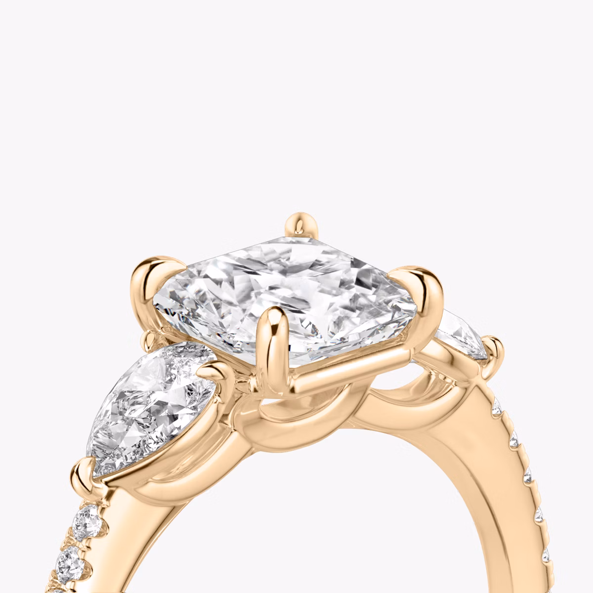 The Three Stone | Asscher | 14k | Rose Gold | bandAccent: Pavé | sideStoneCarat: 0.25ct | sideStoneShape: Pear | diamondOrientation: vertical | caratWeight: other