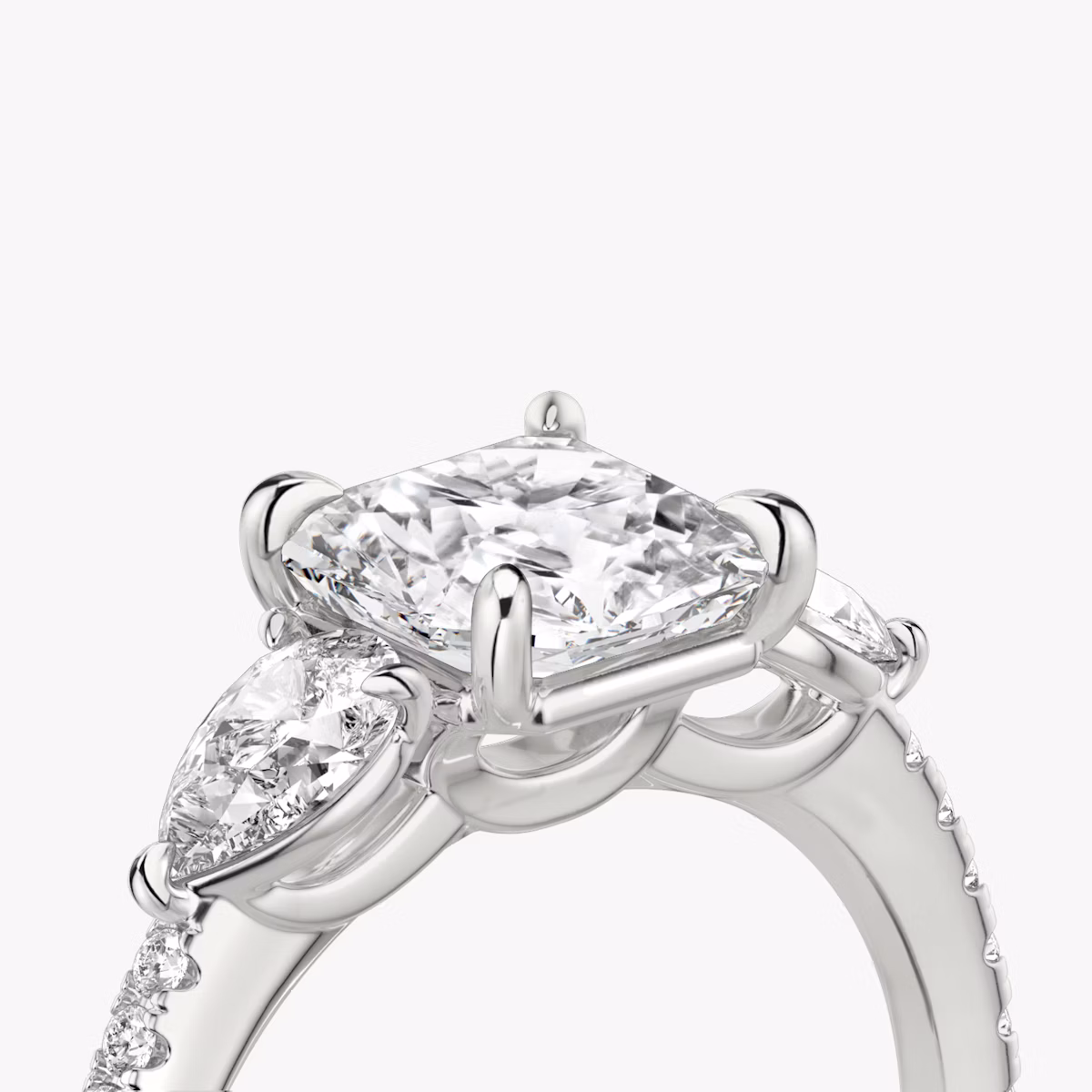 The Three Stone | Asscher | Platinum | bandAccent: Pavé | sideStoneCarat: 0.25ct | sideStoneShape: Pear | diamondOrientation: vertical | caratWeight: other