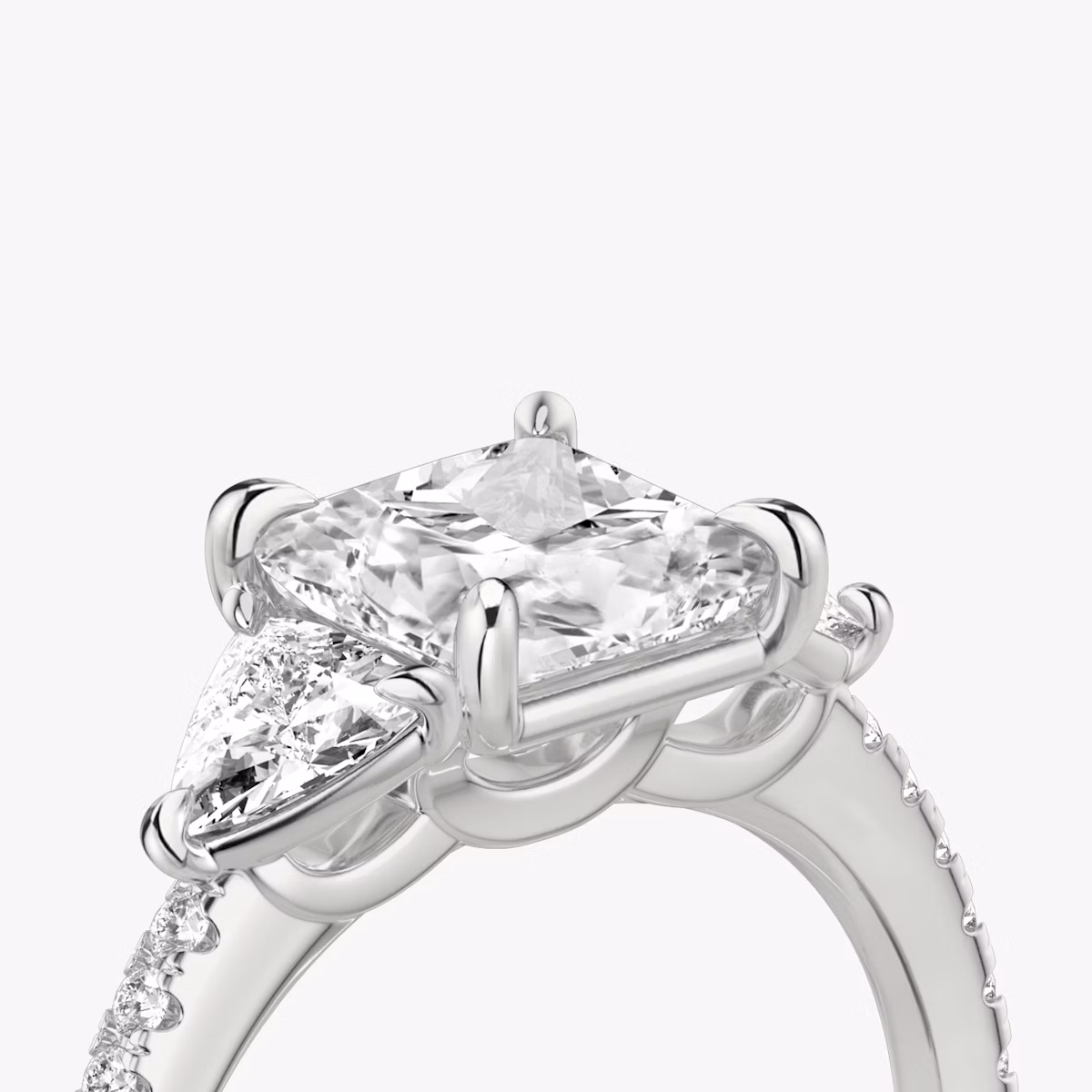 The Three Stone | Princess | Platinum | bandAccent: Pavé | sideStoneCarat: 0.25ct | sideStoneShape: Trillion | diamondOrientation: vertical | caratWeight: other