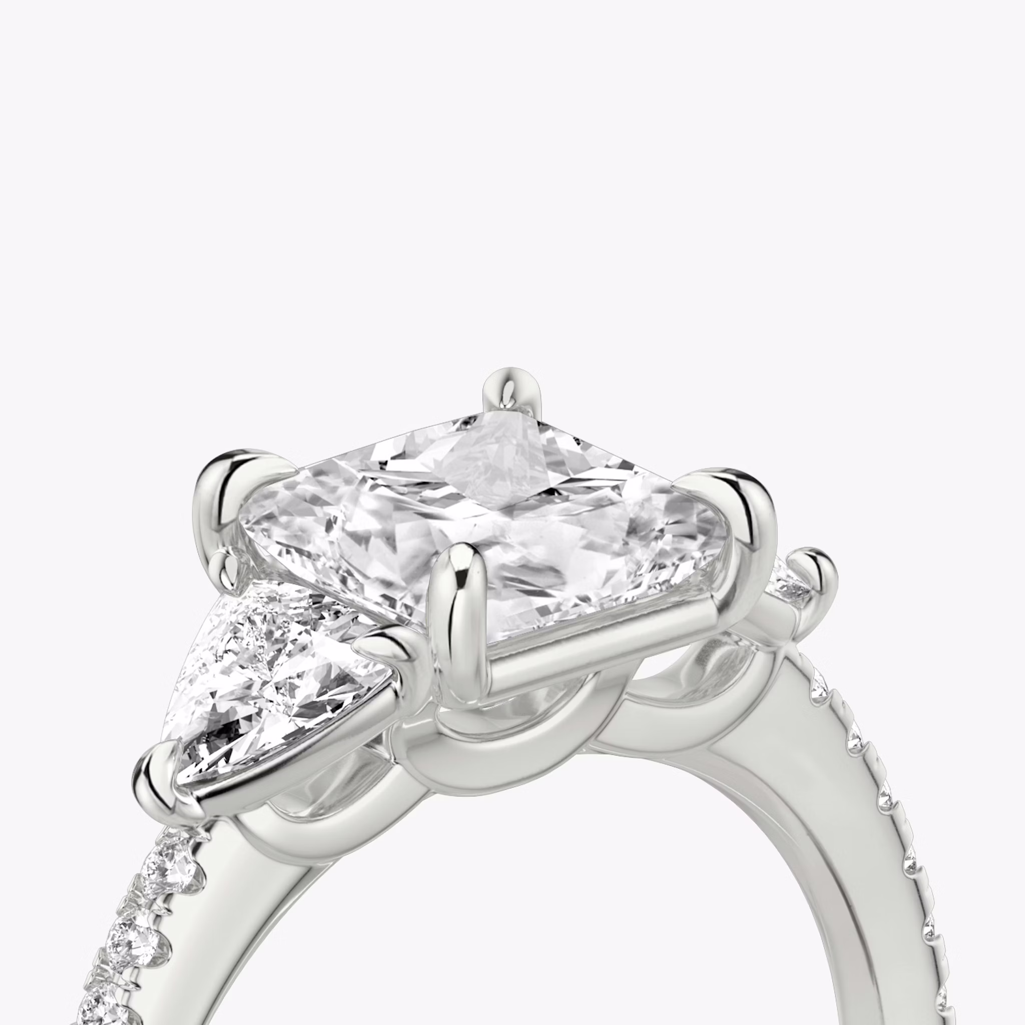The Three Stone | Princess | 18k | White Gold | bandAccent: Pavé | sideStoneCarat: 0.25ct | sideStoneShape: Trillion | diamondOrientation: vertical | caratWeight: other