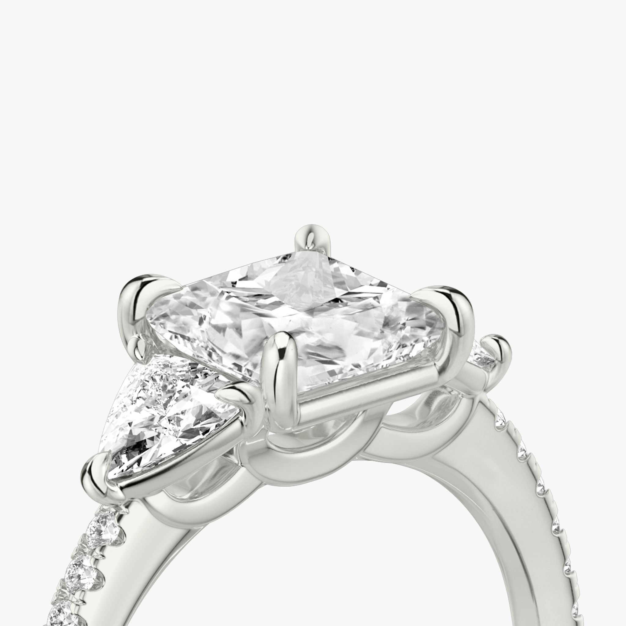 The Three Stone | Princess | 18k | White Gold | bandAccent: Pavé | sideStoneCarat: 0.25ct | sideStoneShape: Trillion | diamondOrientation: vertical | caratWeight: other
