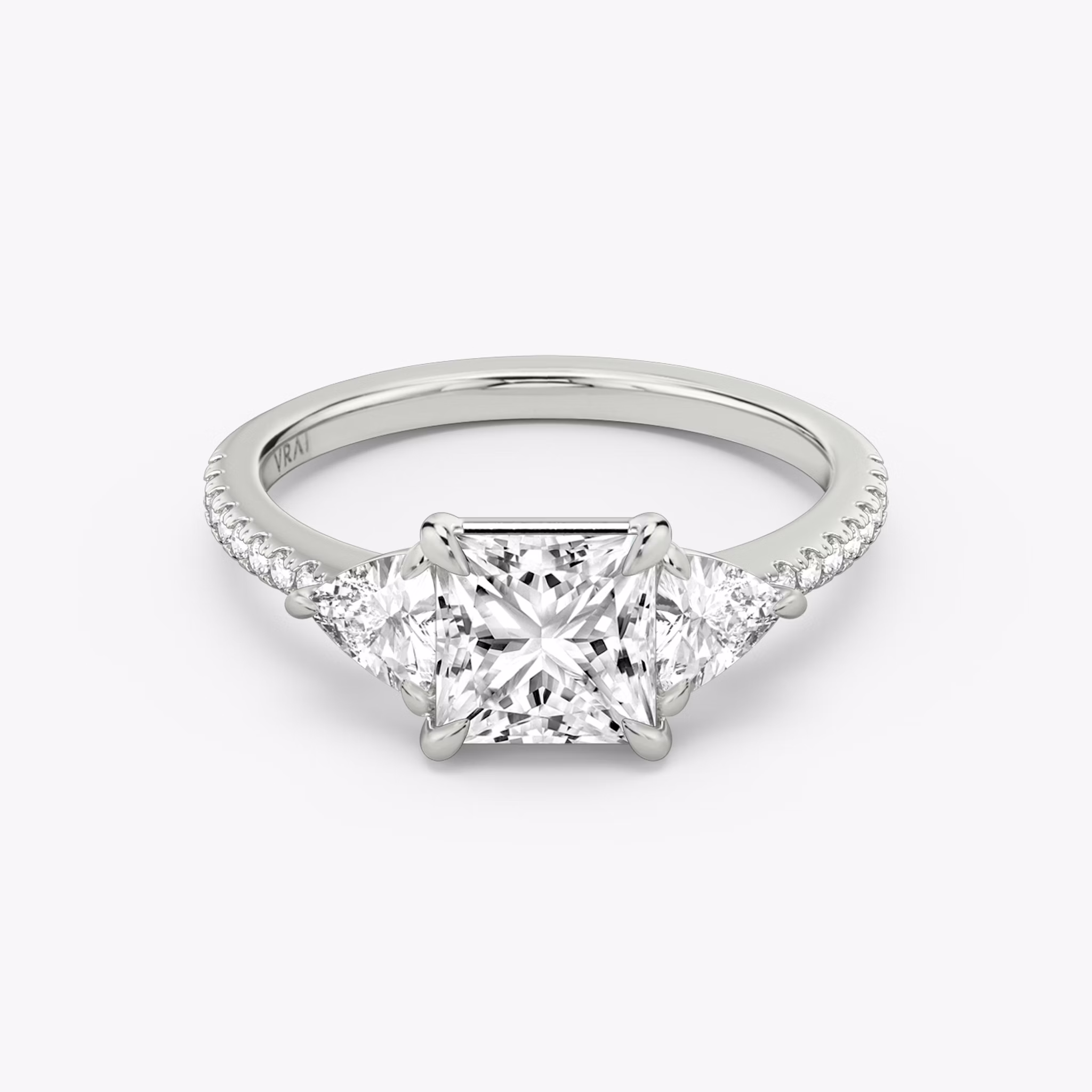 The Three Stone | Princess | 18k | White Gold | bandAccent: Pavé | sideStoneCarat: 0.25ct | sideStoneShape: Trillion | diamondOrientation: vertical | caratWeight: other