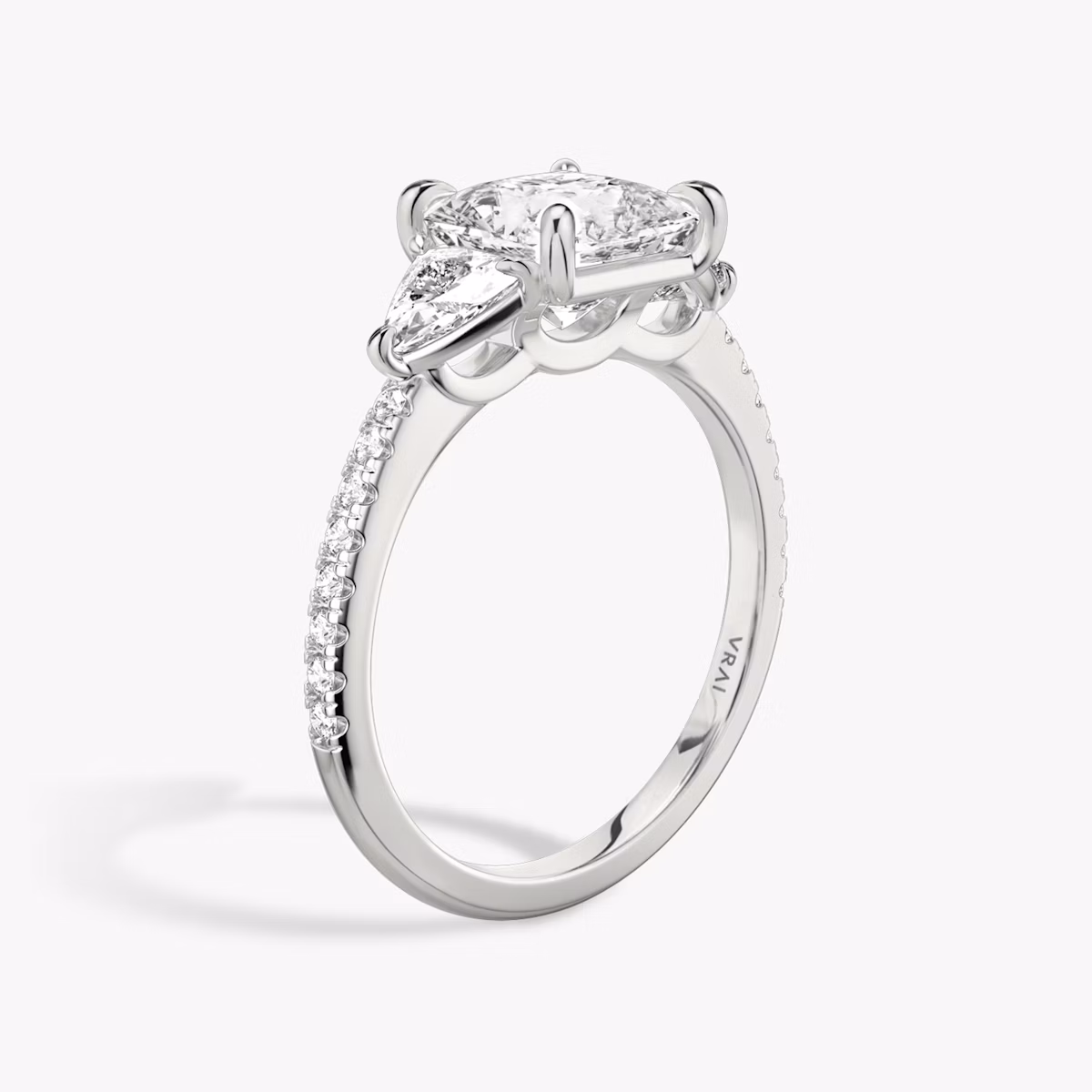 The Three Stone | Princess | Platinum | bandAccent: Pavé | sideStoneCarat: 0.25ct | sideStoneShape: Trillion | diamondOrientation: vertical | caratWeight: other