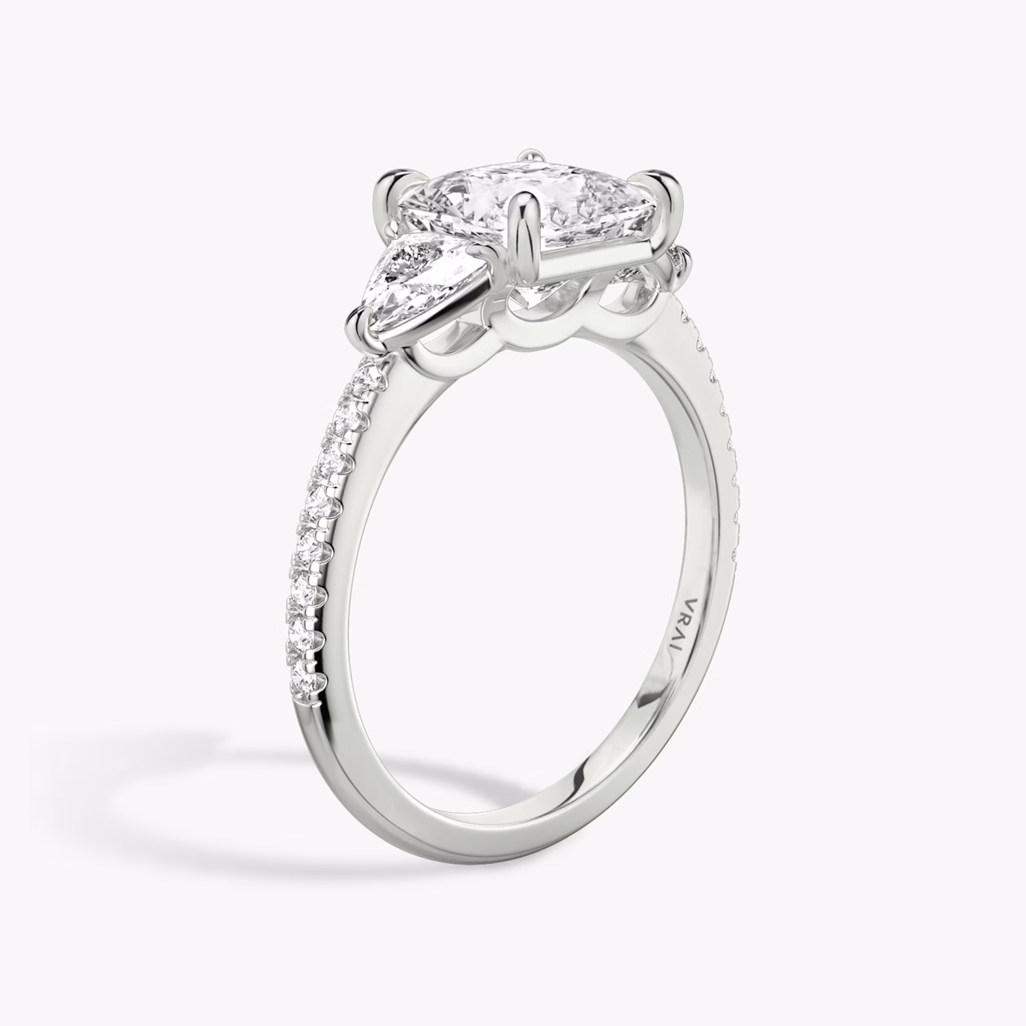 The Three Stone | Princess | 18k | White Gold | bandAccent: Pavé | sideStoneCarat: 0.25ct | sideStoneShape: Trillion | diamondOrientation: vertical | caratWeight: other