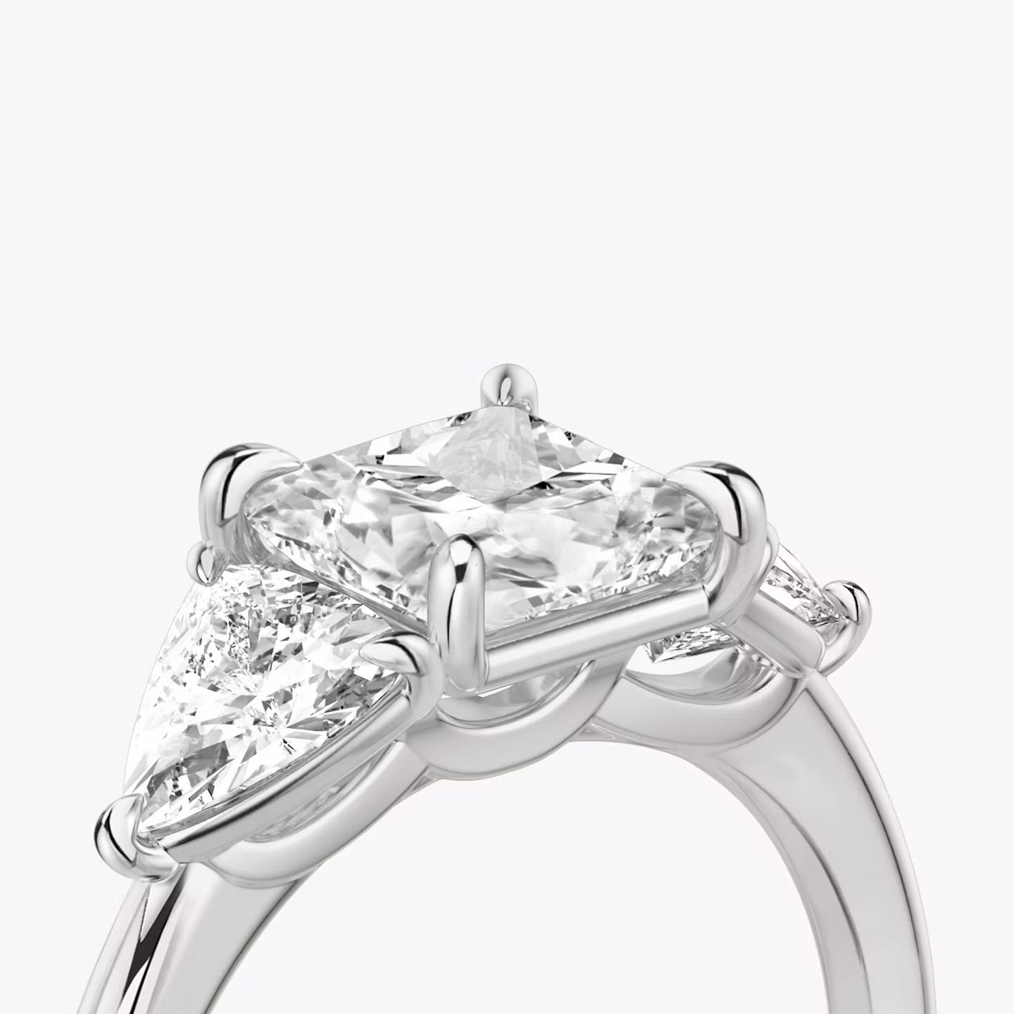 The Three Stone | Princess | Platinum | bandAccent: Plain | sideStoneCarat: 0.50ct | sideStoneShape: Trillion | diamondOrientation: vertical | caratWeight: other