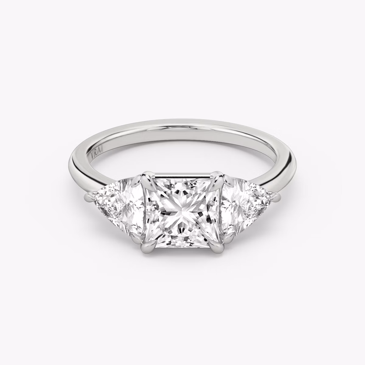 The Three Stone | Princess | Platinum | bandAccent: Plain | sideStoneCarat: 0.50ct | sideStoneShape: Trillion | diamondOrientation: vertical | caratWeight: other