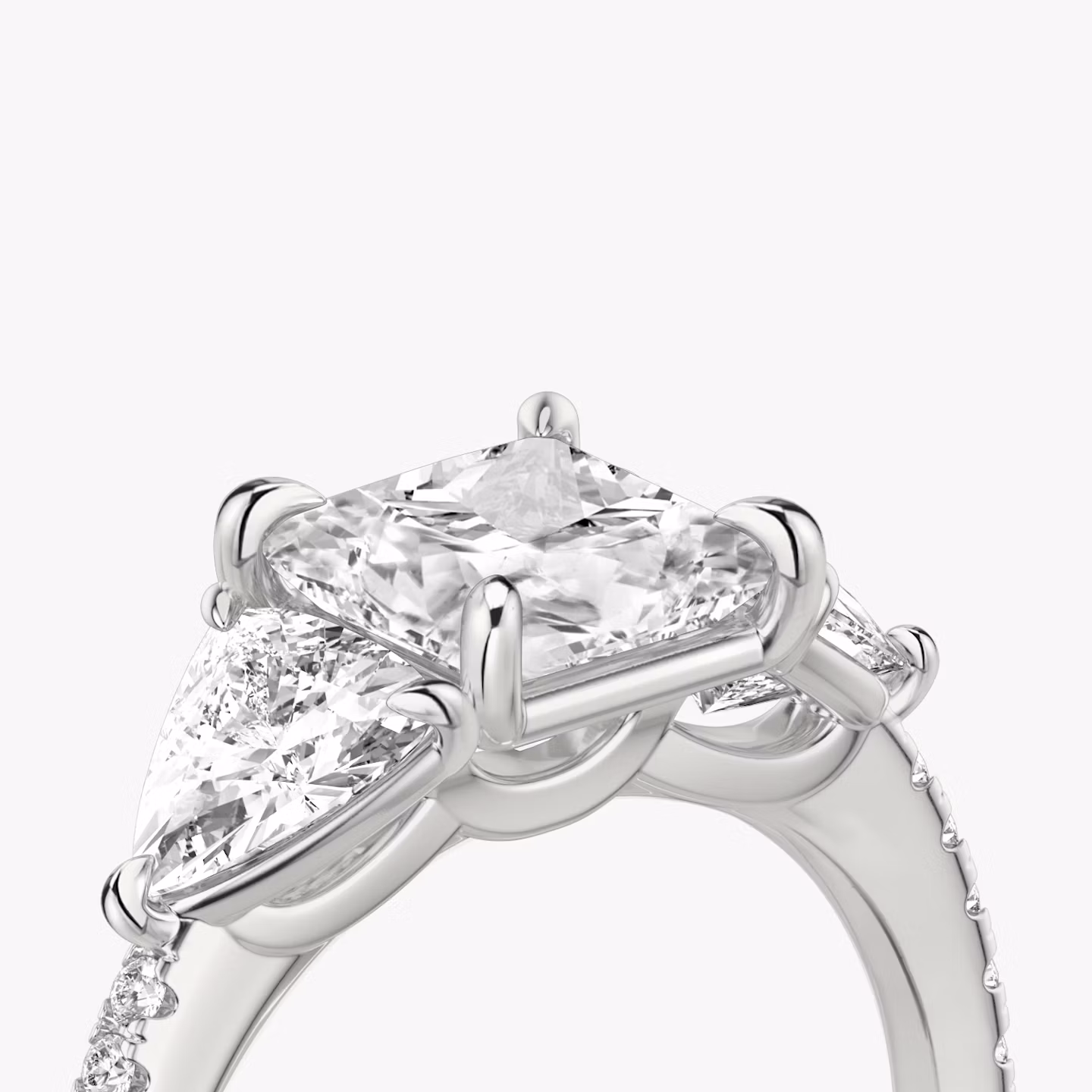 The Three Stone | Princess | Platinum | bandAccent: Pavé | sideStoneCarat: 0.50ct | sideStoneShape: Trillion | diamondOrientation: vertical | caratWeight: other