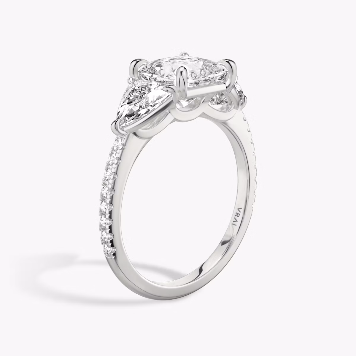 The Three Stone | Princess | Platinum | bandAccent: Pavé | sideStoneCarat: 0.50ct | sideStoneShape: Trillion | diamondOrientation: vertical | caratWeight: other