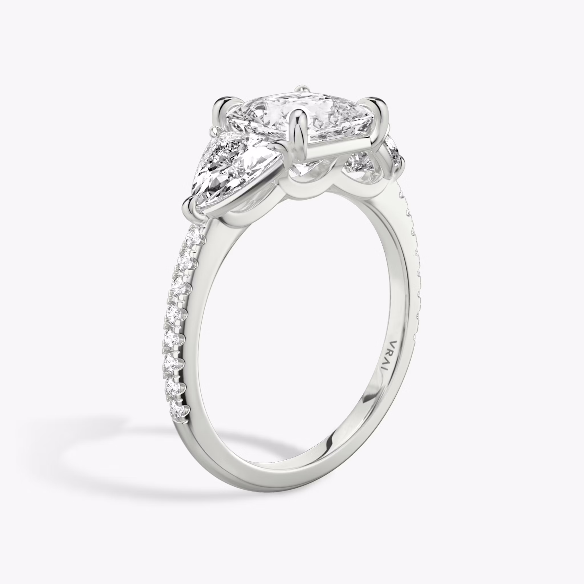 The Three Stone | Princess | 18k | White Gold | bandAccent: Pavé | sideStoneCarat: 0.50ct | sideStoneShape: Trillion | diamondOrientation: vertical | caratWeight: other
