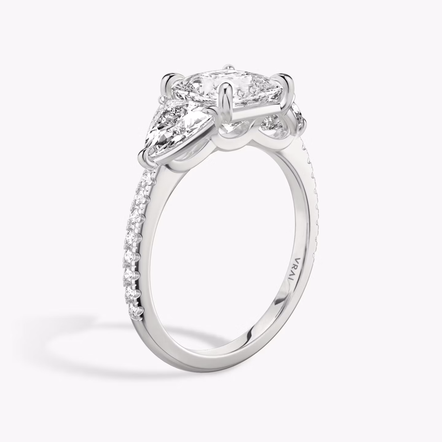 The Three Stone | Princess | Platinum | bandAccent: Pavé | sideStoneCarat: 0.50ct | sideStoneShape: Trillion | diamondOrientation: vertical | caratWeight: other