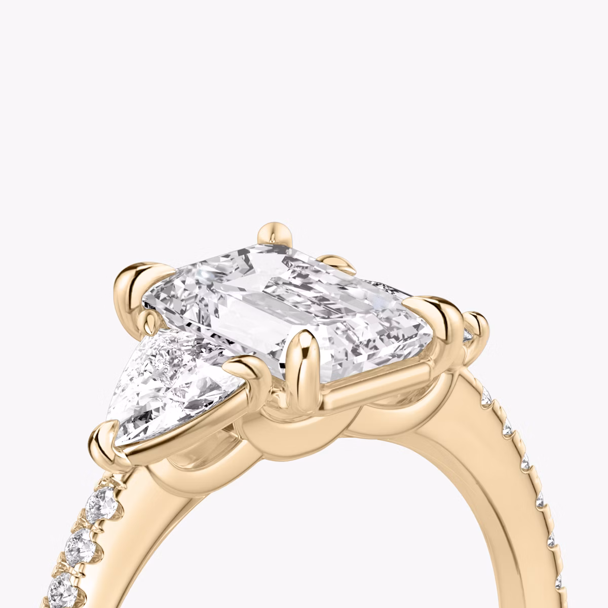 The Three Stone | Emerald | 14k | Rose Gold | bandAccent: Pavé | sideStoneCarat: 0.25ct | sideStoneShape: Trillion | diamondOrientation: vertical | caratWeight: other
