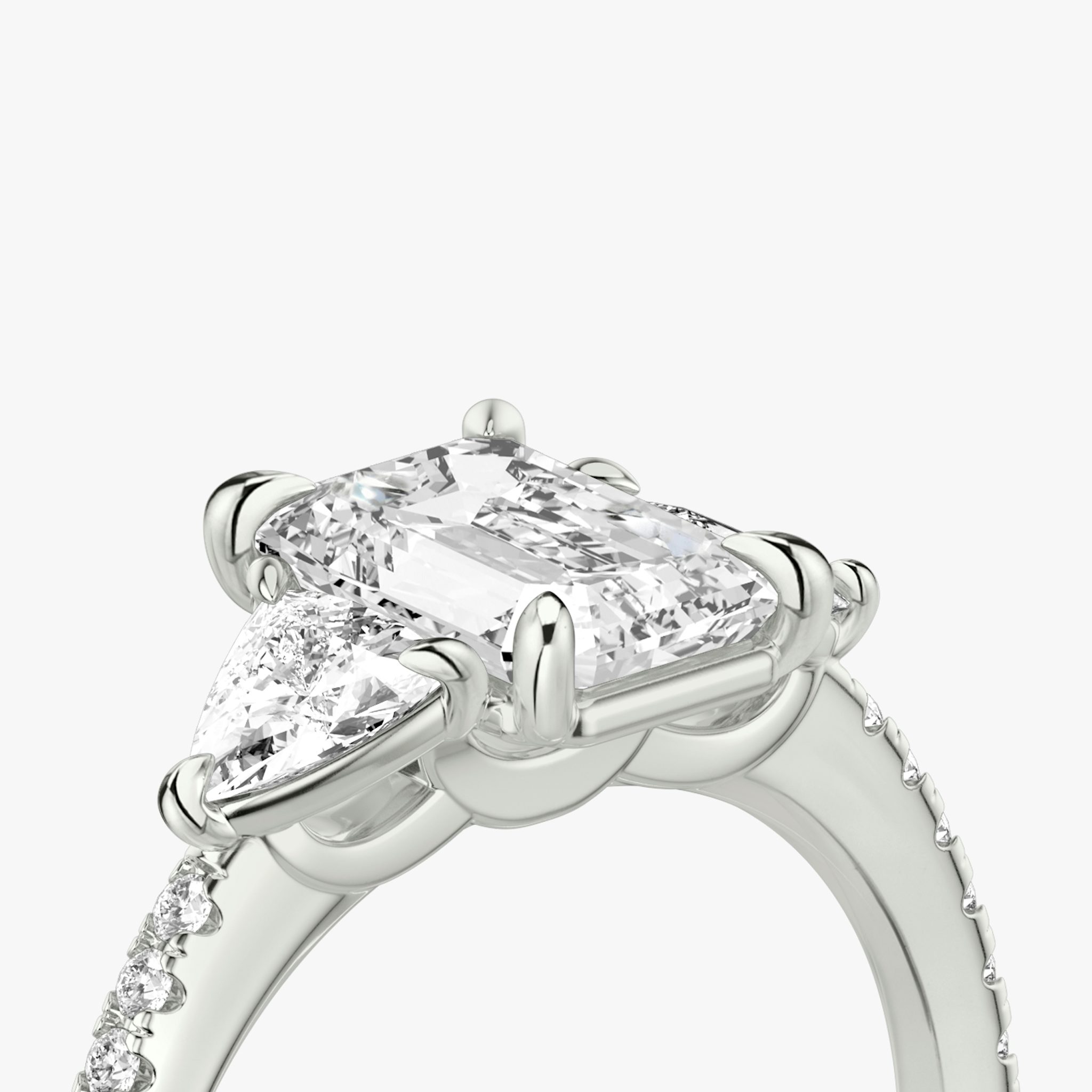 The Three Stone | Emerald | 18k | White Gold | bandAccent: Pavé | sideStoneCarat: 0.25ct | sideStoneShape: Trillion | diamondOrientation: vertical | caratWeight: other