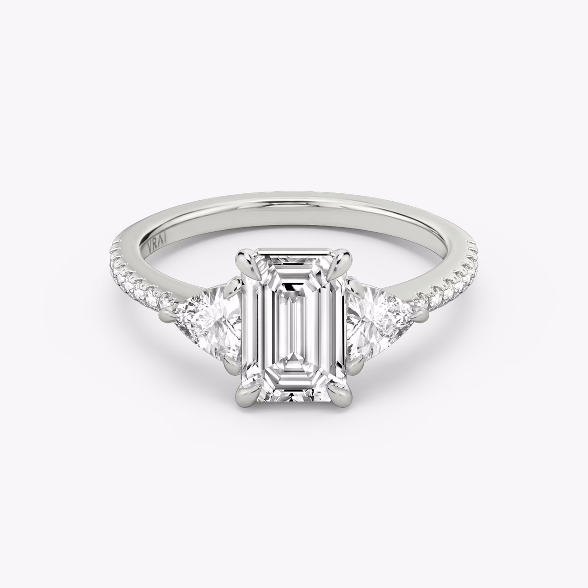 The Three Stone | Emerald | 18k | White Gold | bandAccent: Pavé | sideStoneCarat: 0.25ct | sideStoneShape: Trillion | diamondOrientation: vertical | caratWeight: other