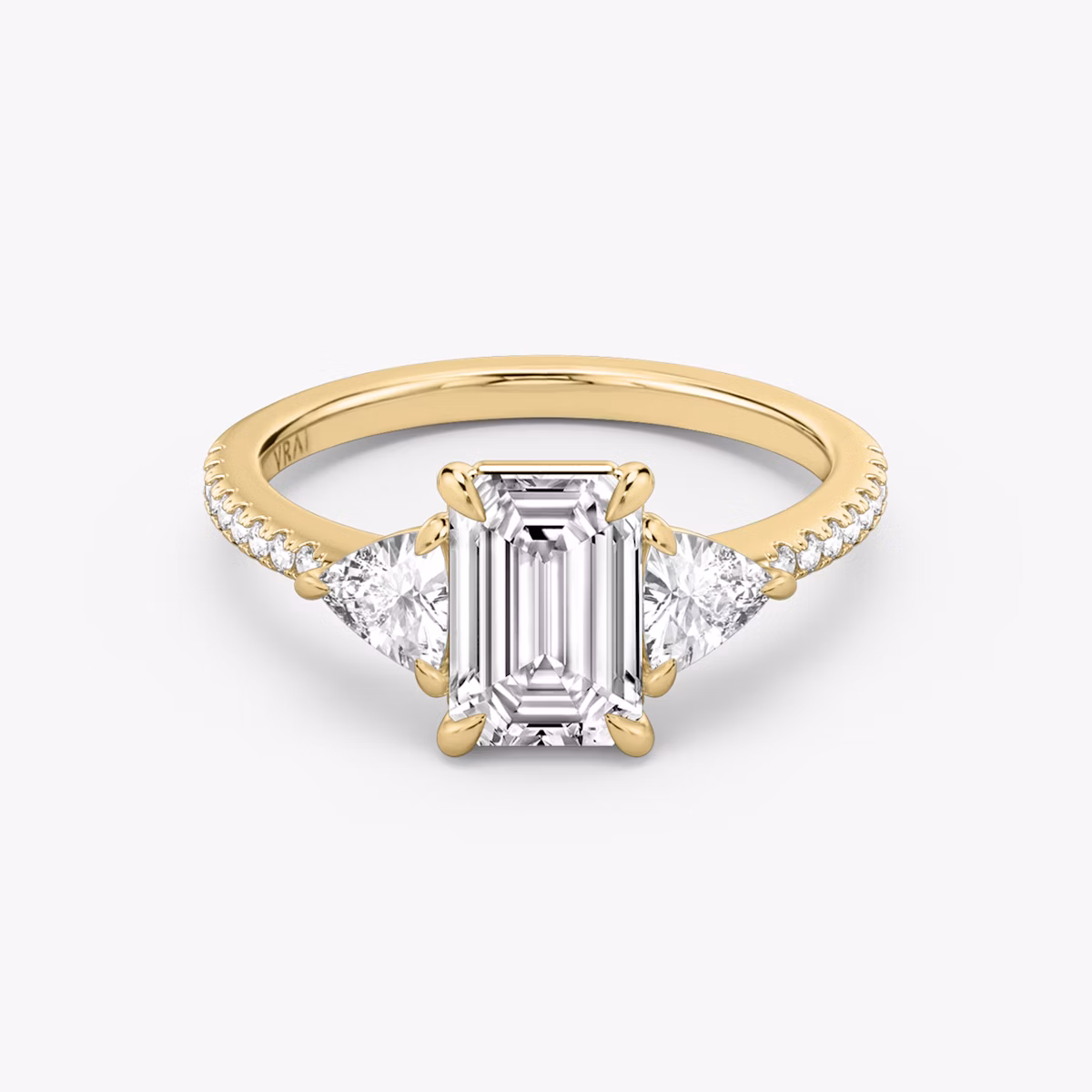 The Three Stone | Emerald | 18k | Yellow Gold | bandAccent: Pavé | sideStoneCarat: 0.25ct | sideStoneShape: Trillion | diamondOrientation: vertical | caratWeight: other