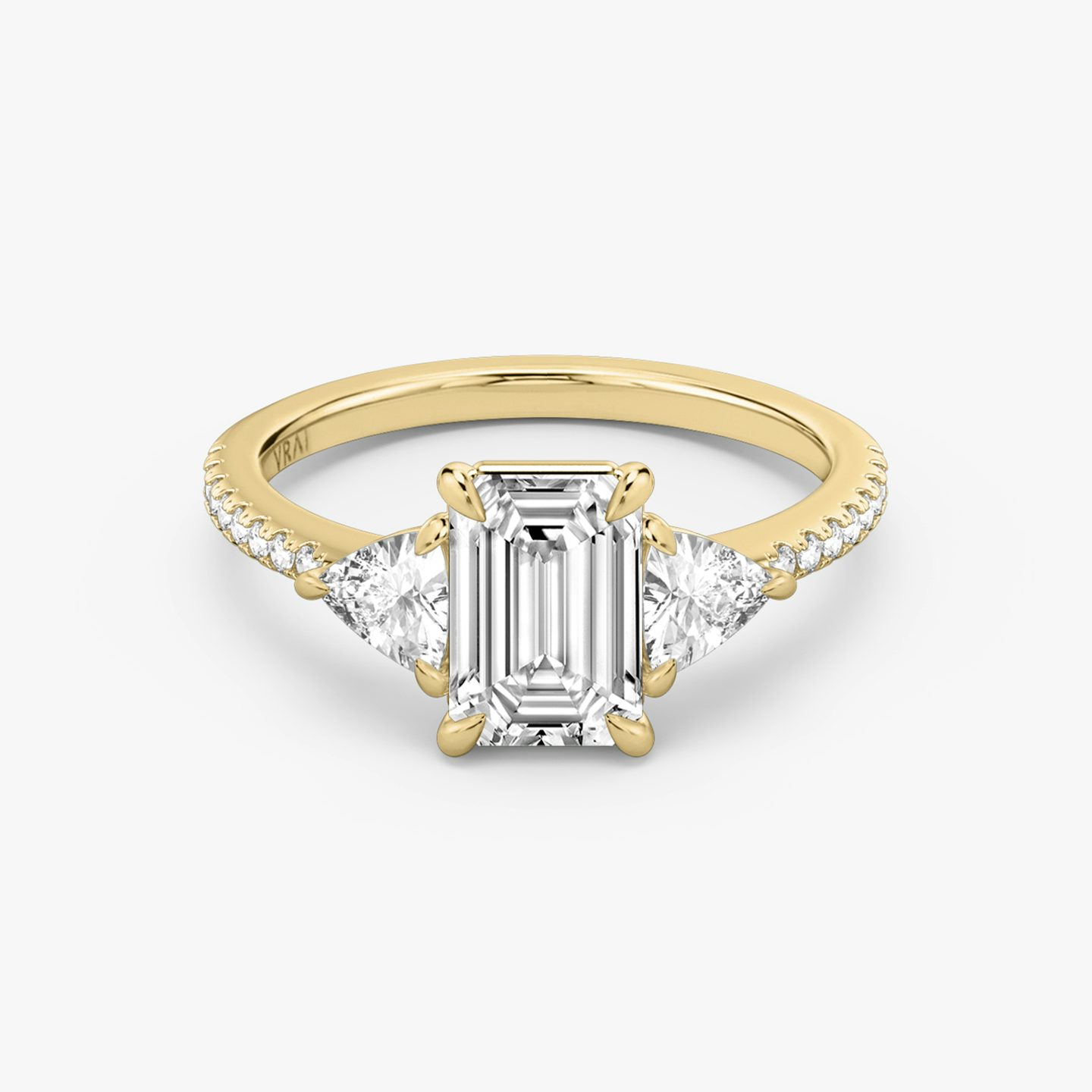 The Three Stone | Emerald | 18k | Yellow Gold | bandAccent: Pavé | sideStoneCarat: 0.25ct | sideStoneShape: Trillion | diamondOrientation: vertical | caratWeight: other