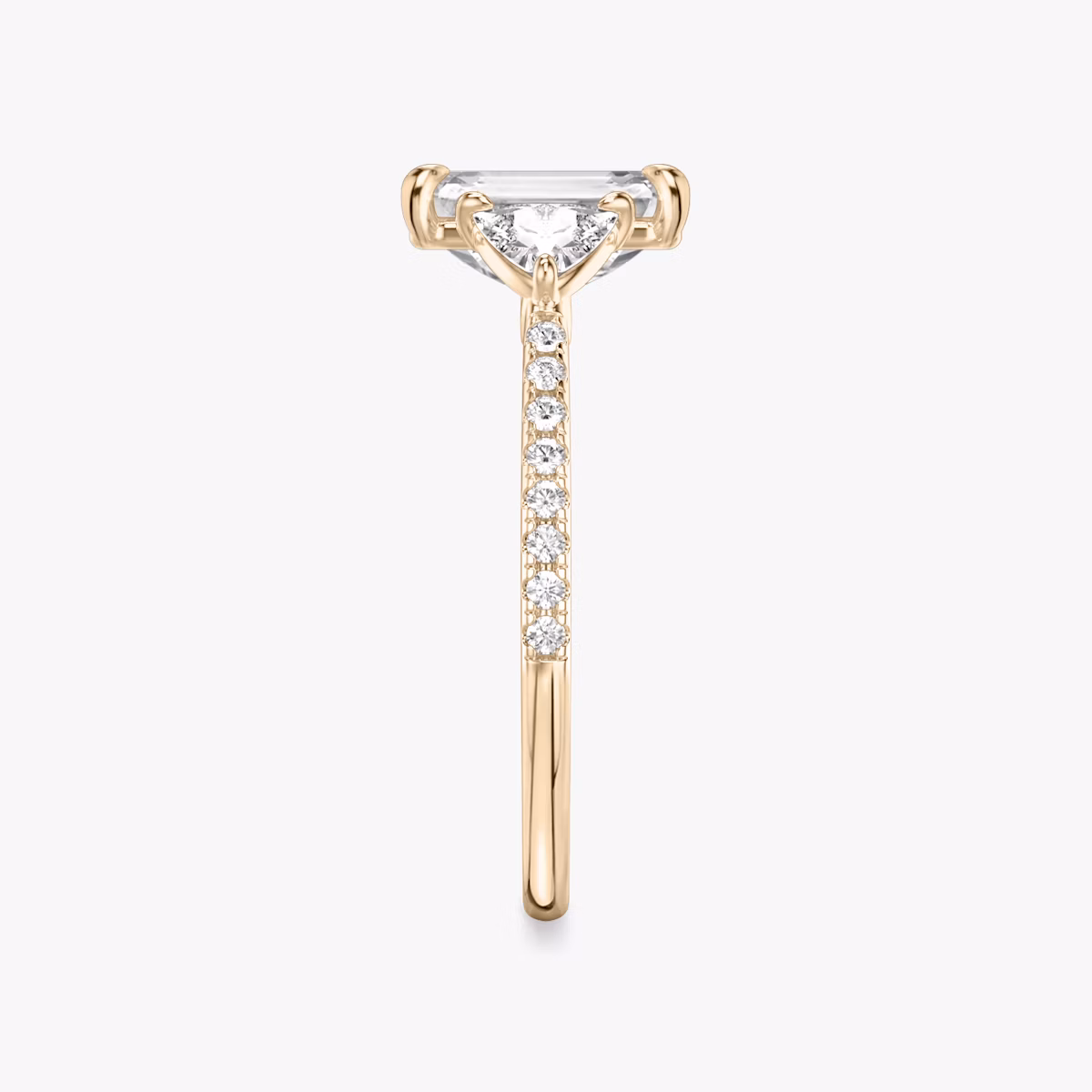 The Three Stone | Emerald | 14k | Rose Gold | bandAccent: Pavé | sideStoneCarat: 0.25ct | sideStoneShape: Trillion | diamondOrientation: vertical | caratWeight: other