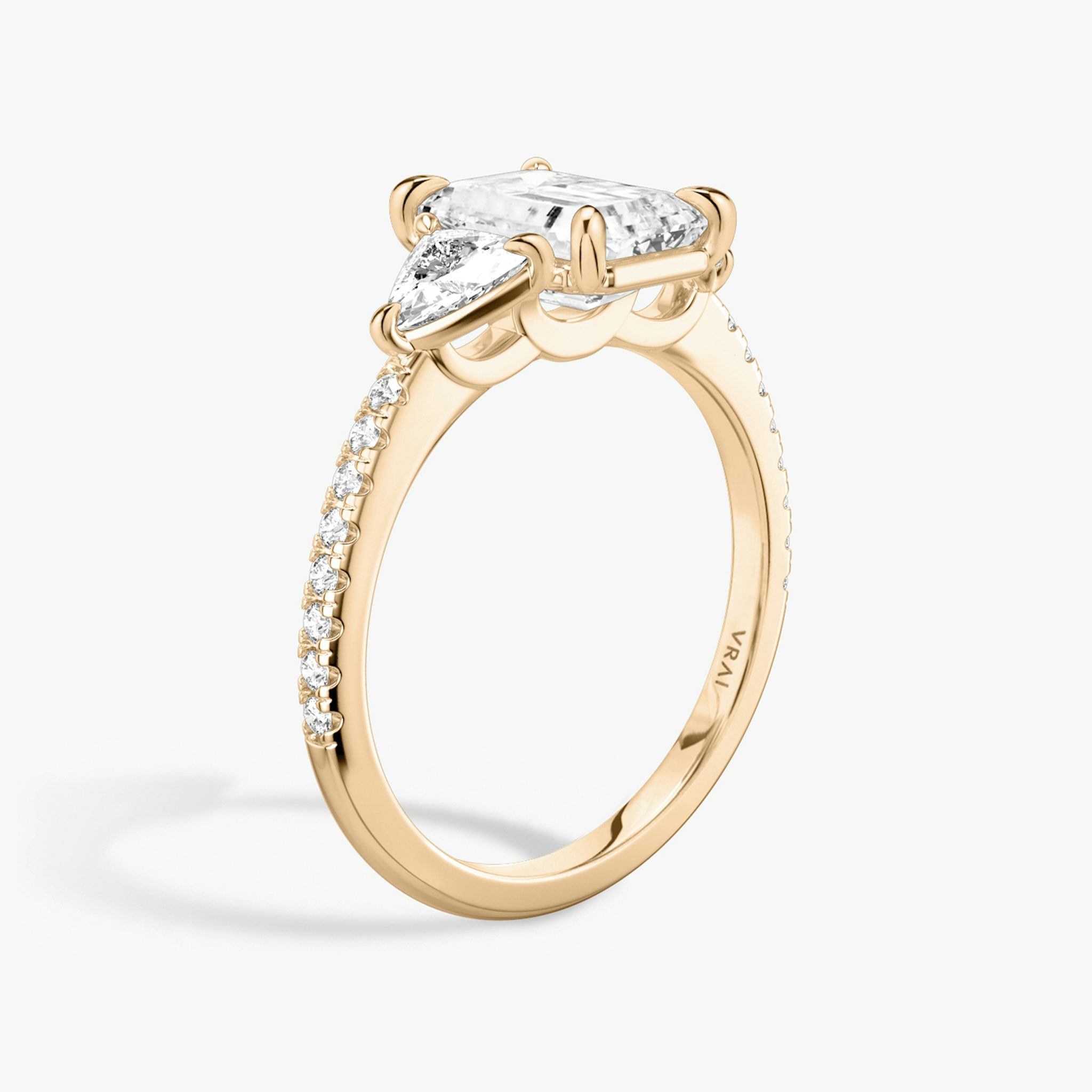 The Three Stone | Emerald | 14k | Rose Gold | bandAccent: Pavé | sideStoneCarat: 0.25ct | sideStoneShape: Trillion | diamondOrientation: vertical | caratWeight: other