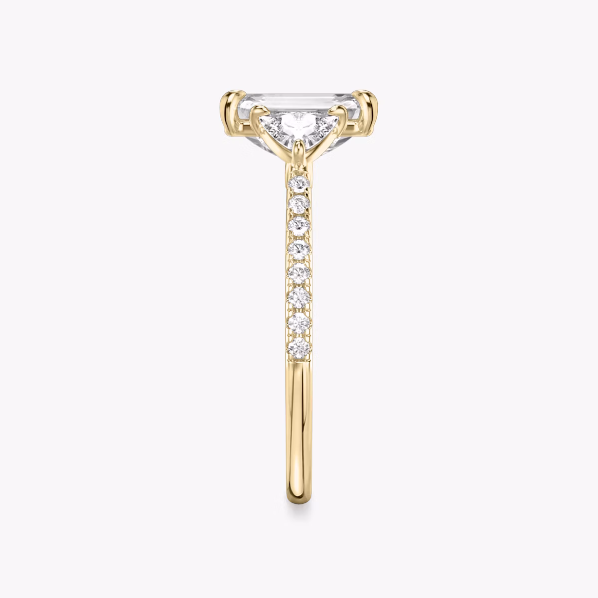 The Three Stone | Emerald | 18k | Yellow Gold | bandAccent: Pavé | sideStoneCarat: 0.25ct | sideStoneShape: Trillion | diamondOrientation: vertical | caratWeight: other