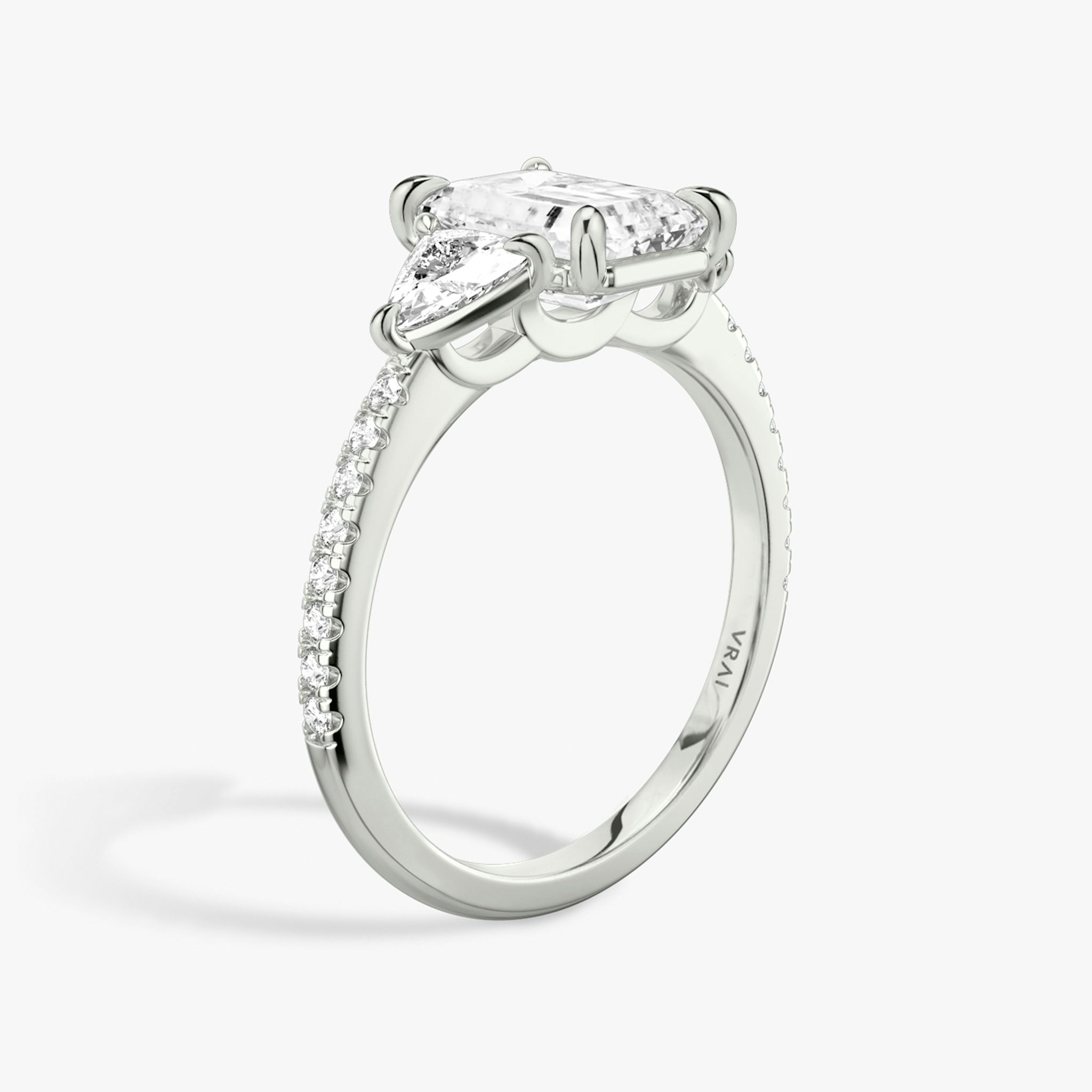 The Three Stone | Emerald | 18k | White Gold | bandAccent: Pavé | sideStoneCarat: 0.25ct | sideStoneShape: Trillion | diamondOrientation: vertical | caratWeight: other