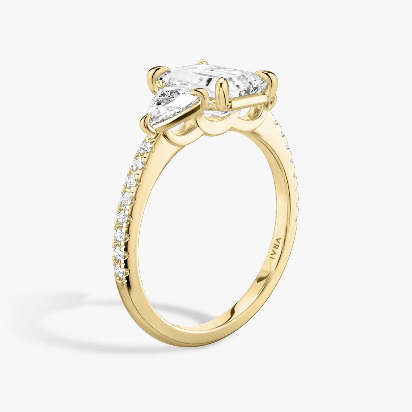 The Three Stone | Emerald | 18k | Yellow Gold | bandAccent: Pavé | sideStoneCarat: 0.25ct | sideStoneShape: Trillion | diamondOrientation: vertical | caratWeight: other